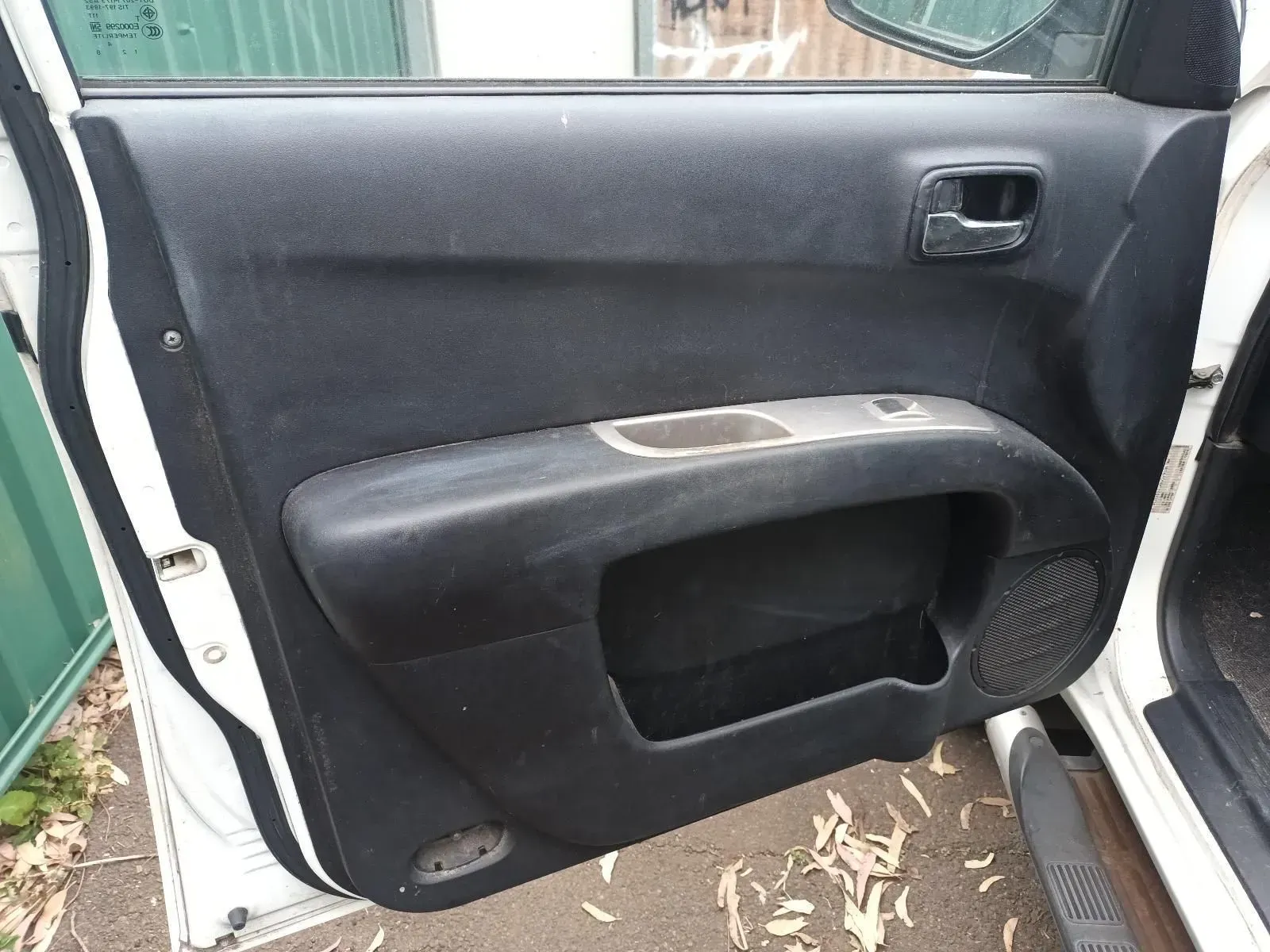 Black Car Door Panel With Handle, Window Controls, and Speaker — South West 4WD Wreckers In Brisbane, QLD