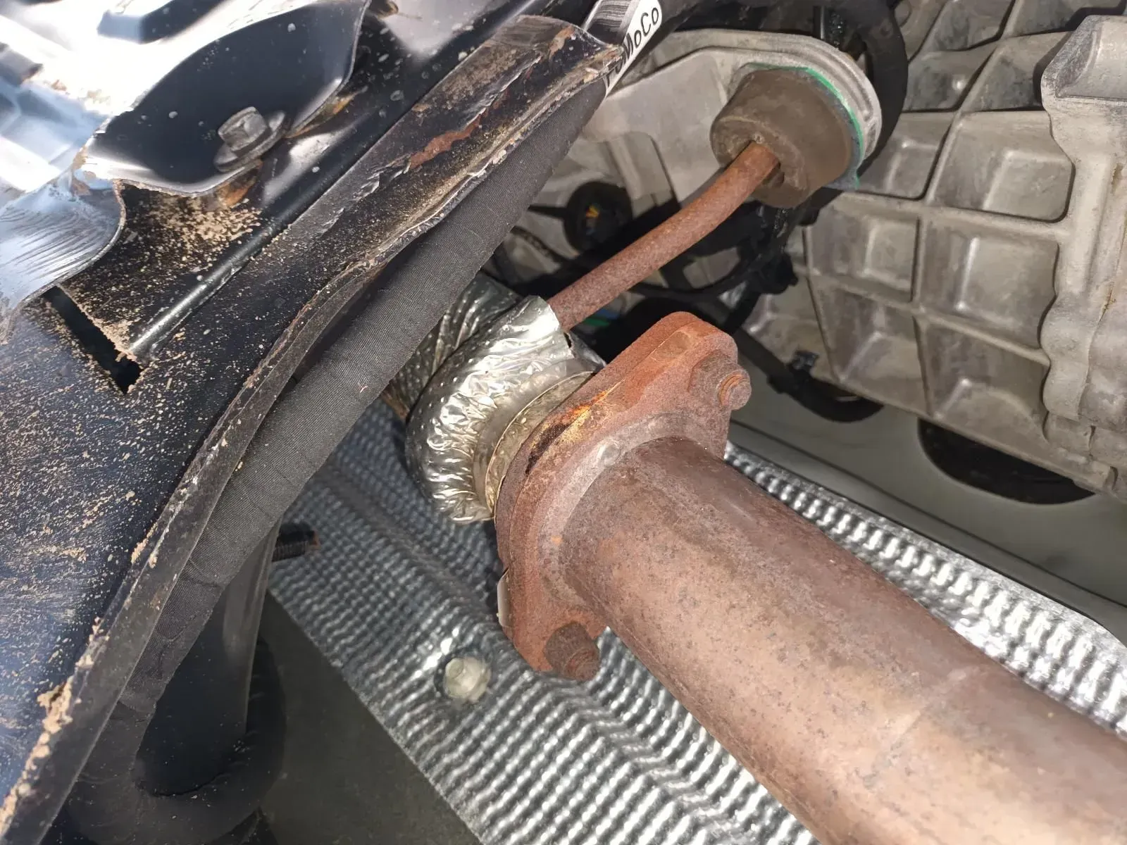 Rusty Car Exhaust Pipe With a Flange Connection — South West 4WD Wreckers In Brisbane, QLD