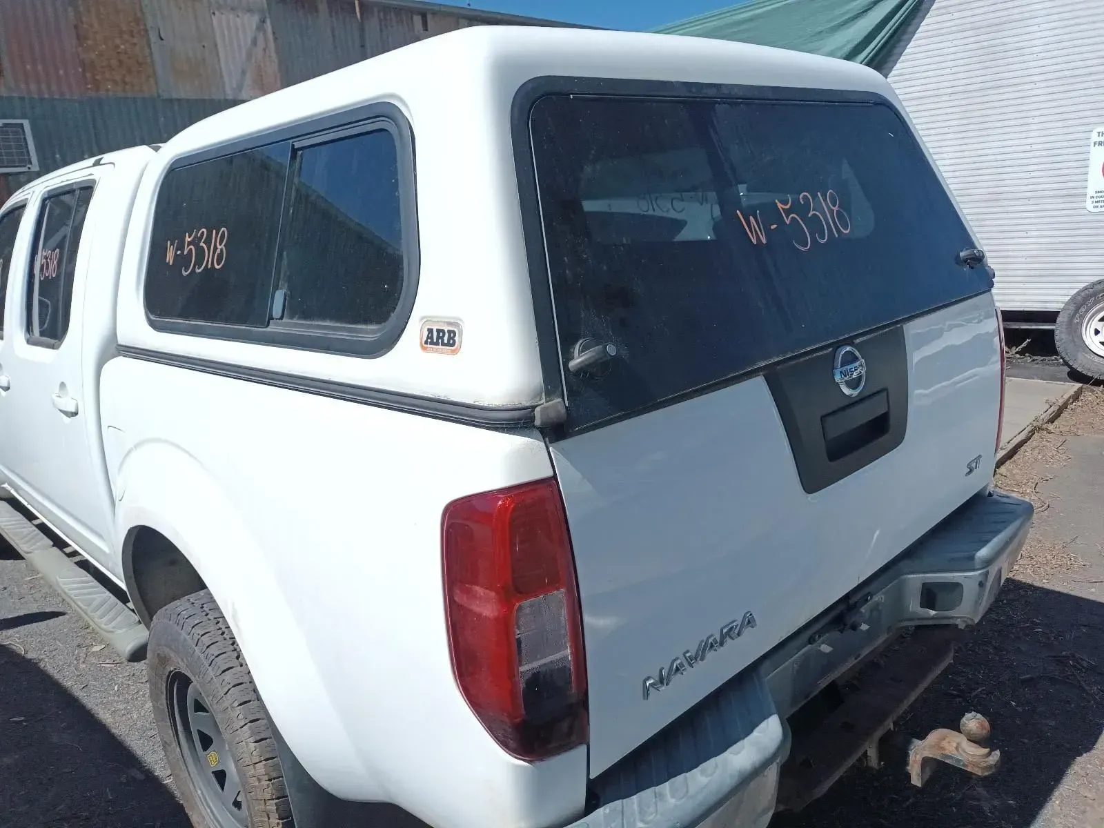 White Nissan Pickup Truck With a Canopy — South West 4WD Wreckers In Brisbane, QLD