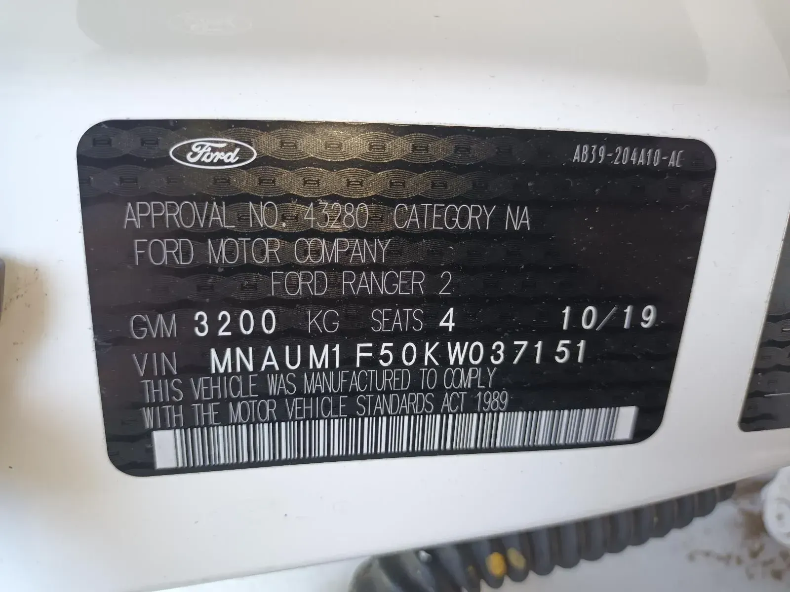 Vehicle Identification Sticker on a White Ford Ranger Truck — South West 4WD Wreckers In Brisbane, QLD