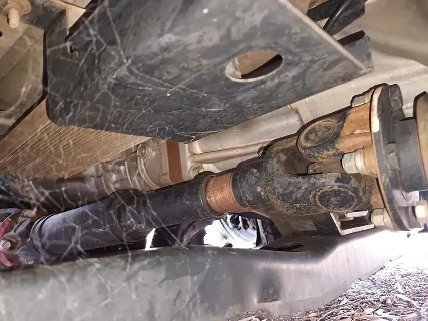 A Close Up of the Underside of a Car With a Hose Coming Out of It — South West 4WD Wreckers In Brisbane, QLD