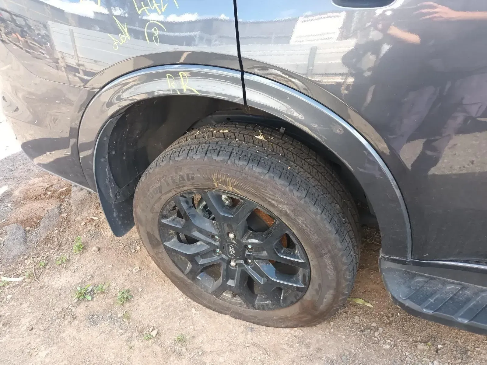 Flat Tyre on a Dark Gray SUV — South West 4WD Wreckers In Brisbane, QLD