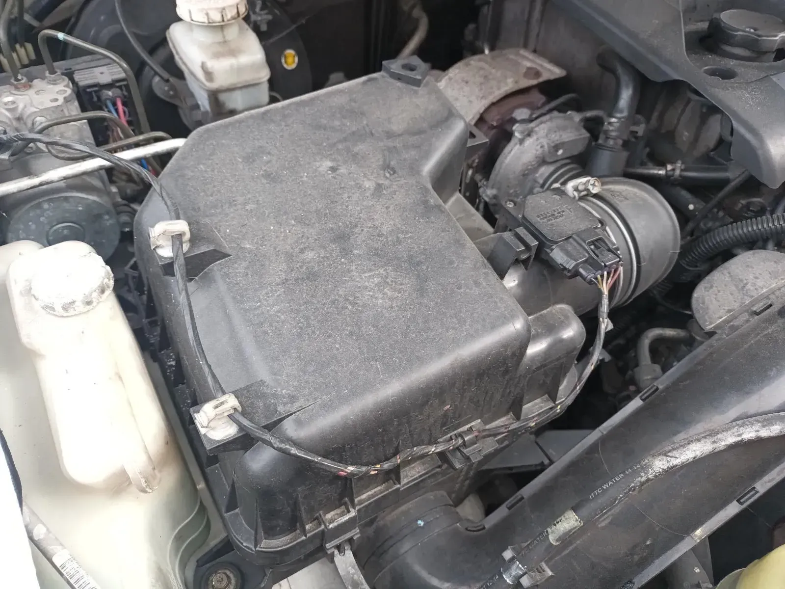 Engine Bay With Black Air Filter Box, Various Hoses, and Other Components — South West 4WD Wreckers In Brisbane, QLD