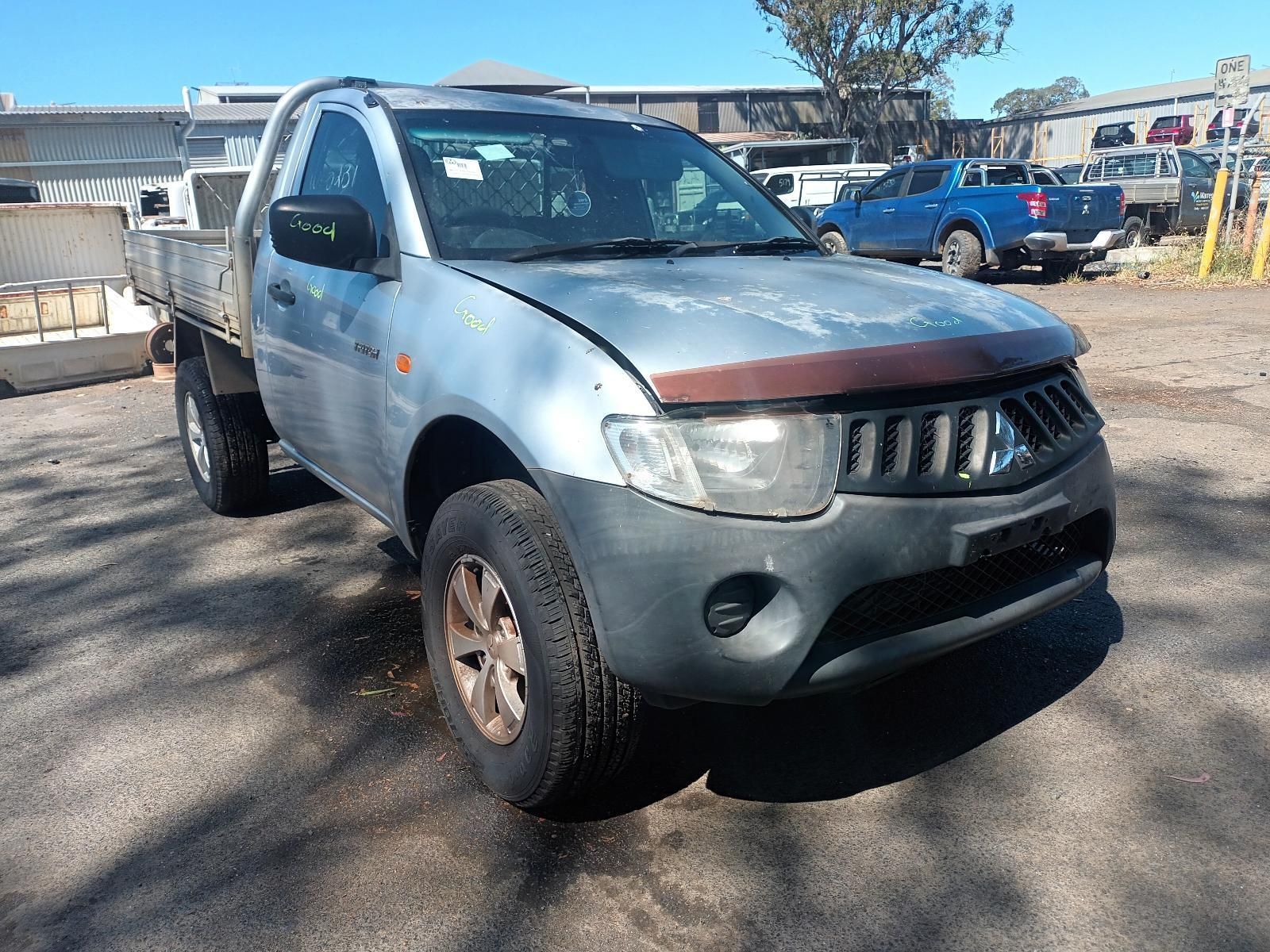 A Silver Pickup Truck is Parked in a Parking Lot — South West 4WD Wreckers In Brisbane, QLD