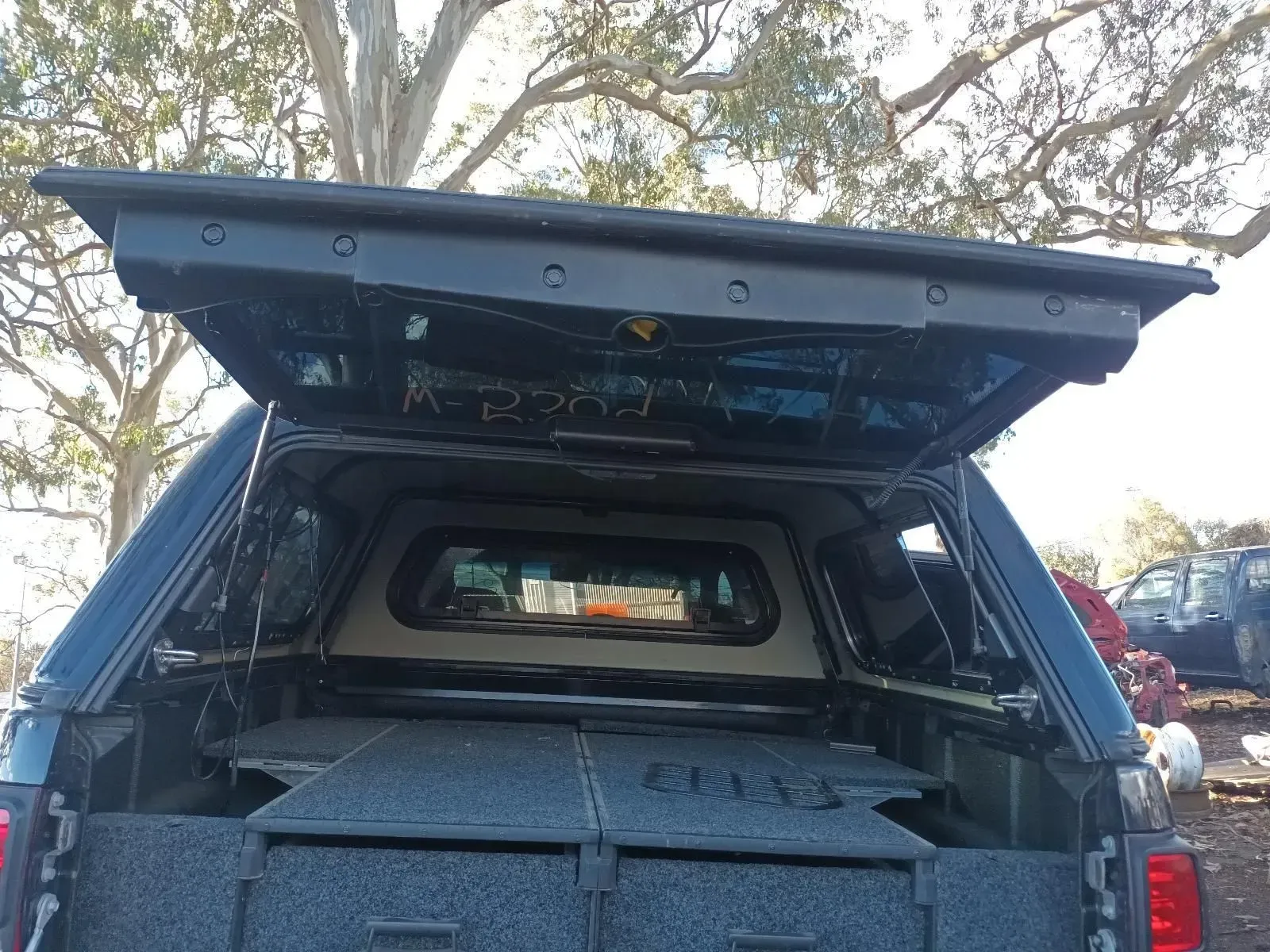 Black Truck Bed Canopy Open, Revealing Drawers and Interior — South West 4WD Wreckers In Brisbane, QLD