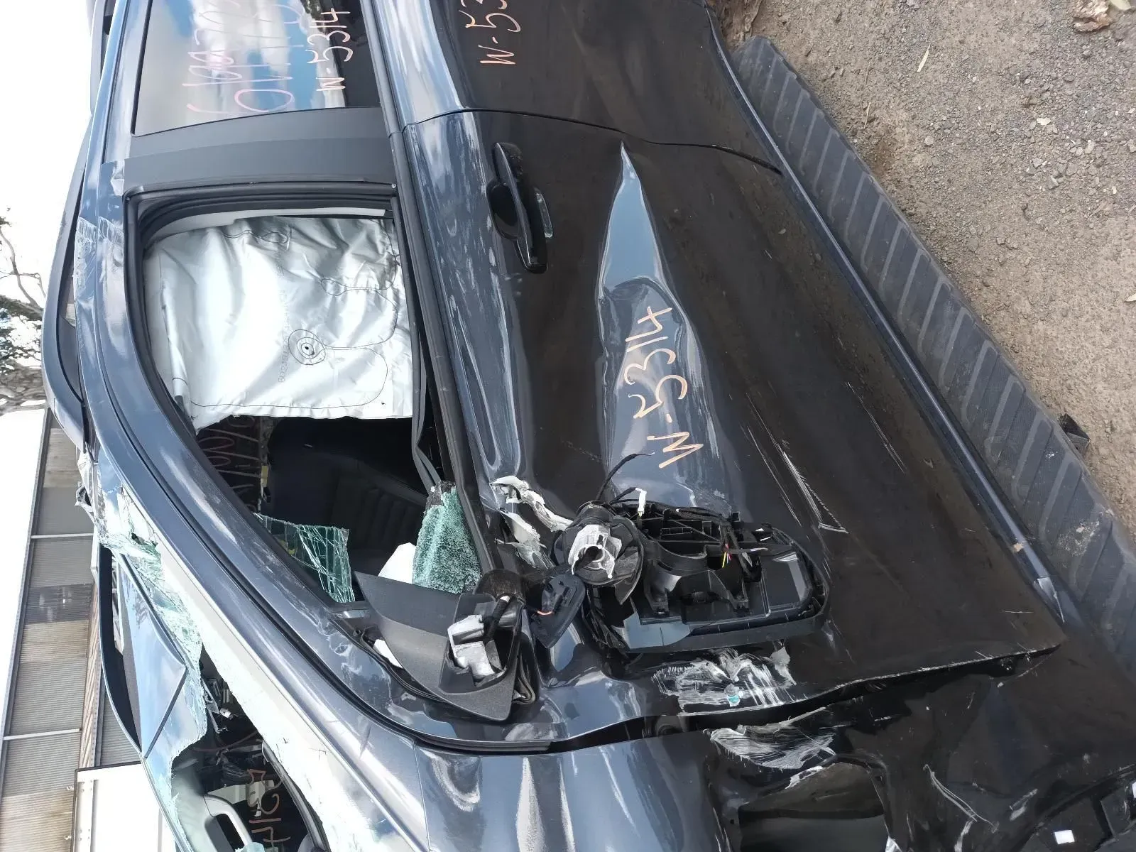 Damaged Black Car Door After a Collision, Airbag Deployed, Window Shattered — South West 4WD Wreckers In Brisbane, QLD