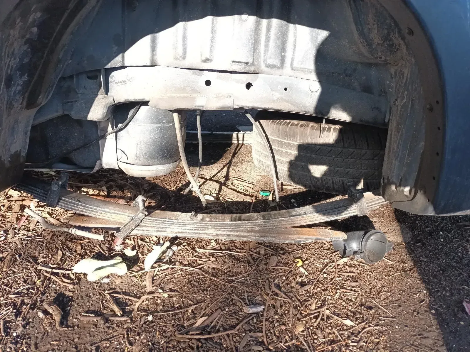 Underneath of a Car, Showing Rear Suspension, Spare Tyre, and Rust — South West 4WD Wreckers In Brisbane, QLD