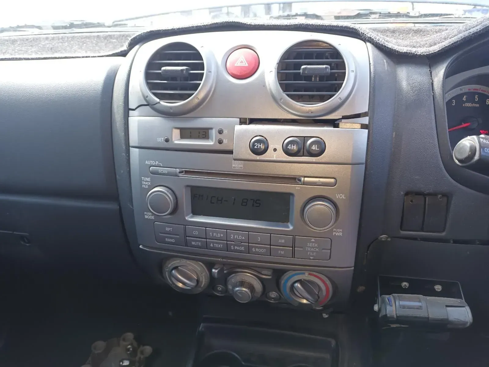 Dashboard of a Silver and Black Vehicle With Radio Controls — South West 4WD Wreckers In Brisbane, QLD