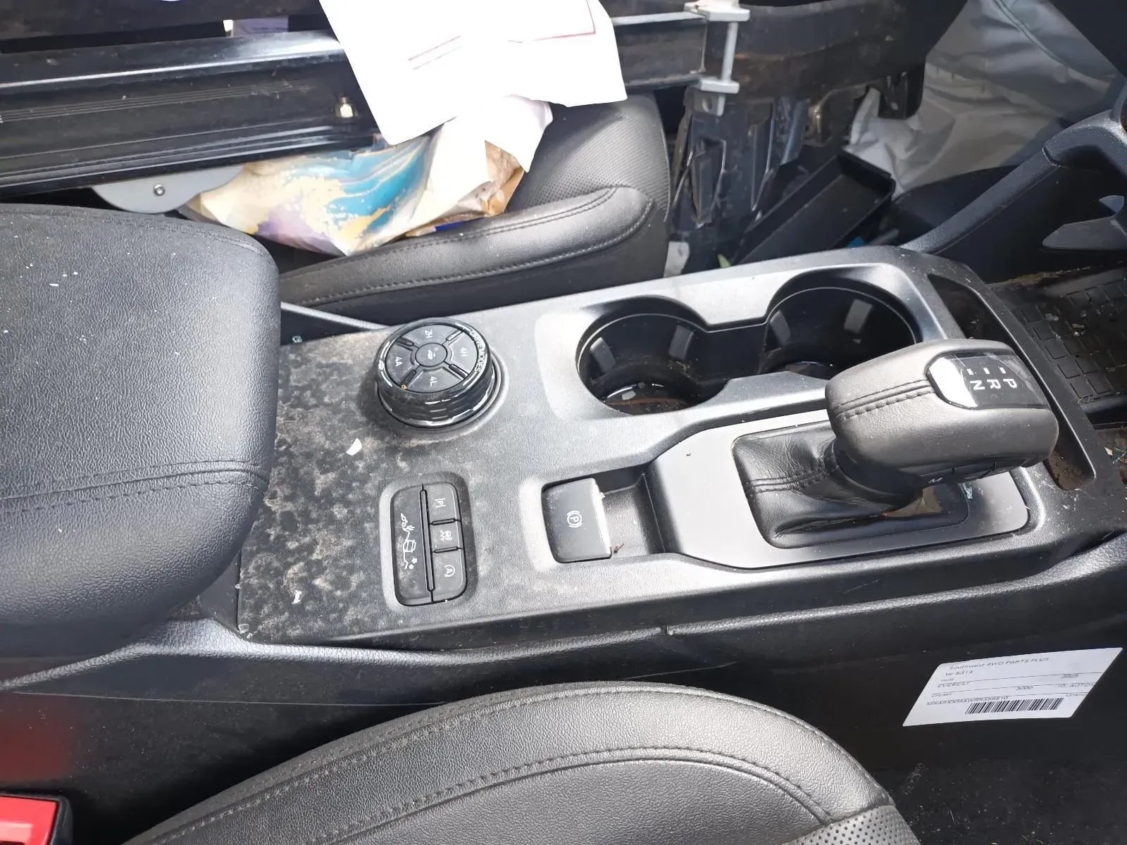 Black Car Interior Center Console With Gear Shift, Cup Holders, and Control Dial — South West 4WD Wreckers In Brisbane, QLD