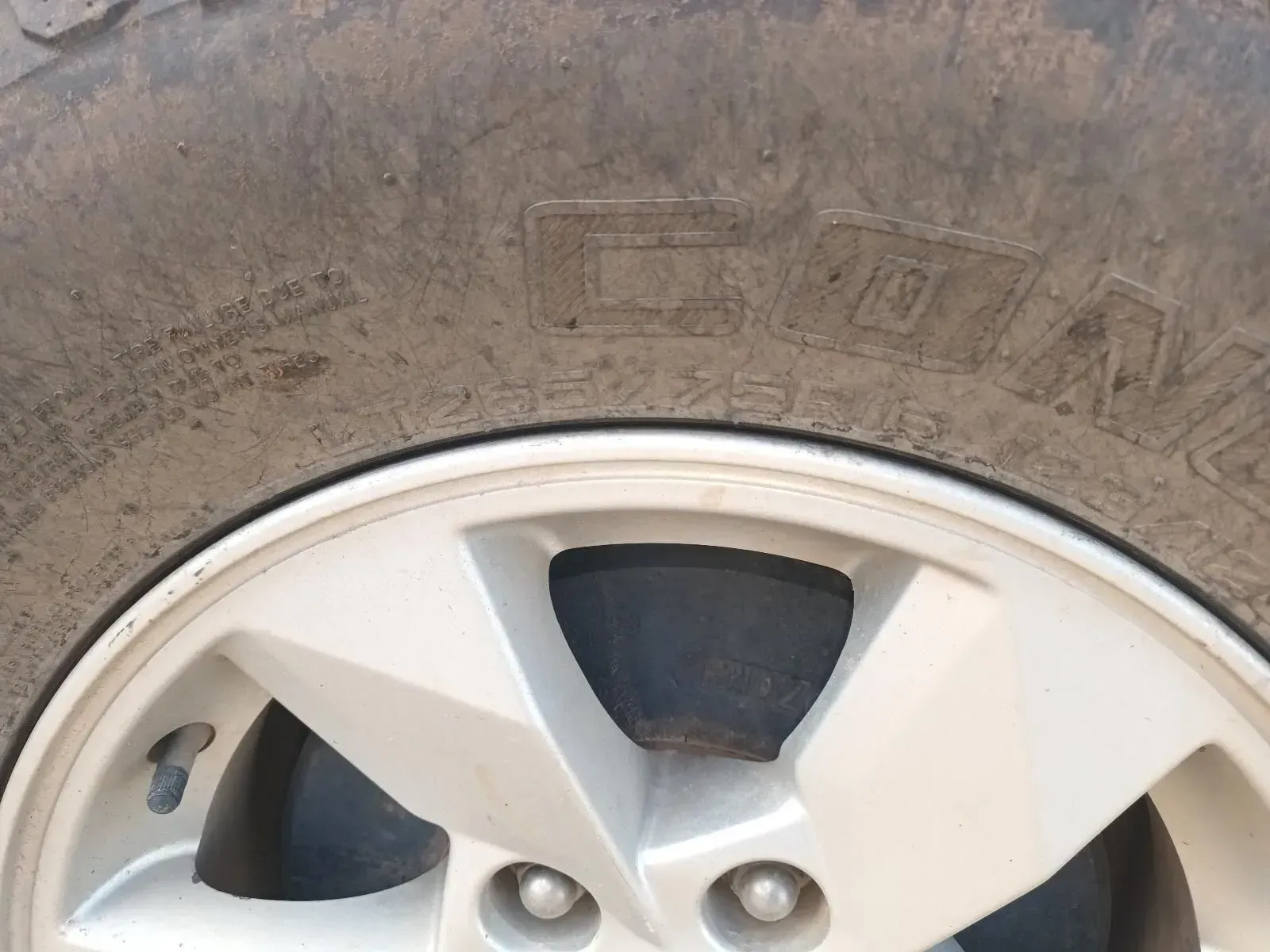 Close-up of a Muddy Tyre and Silver Wheel — South West 4WD Wreckers In Brisbane, QLD