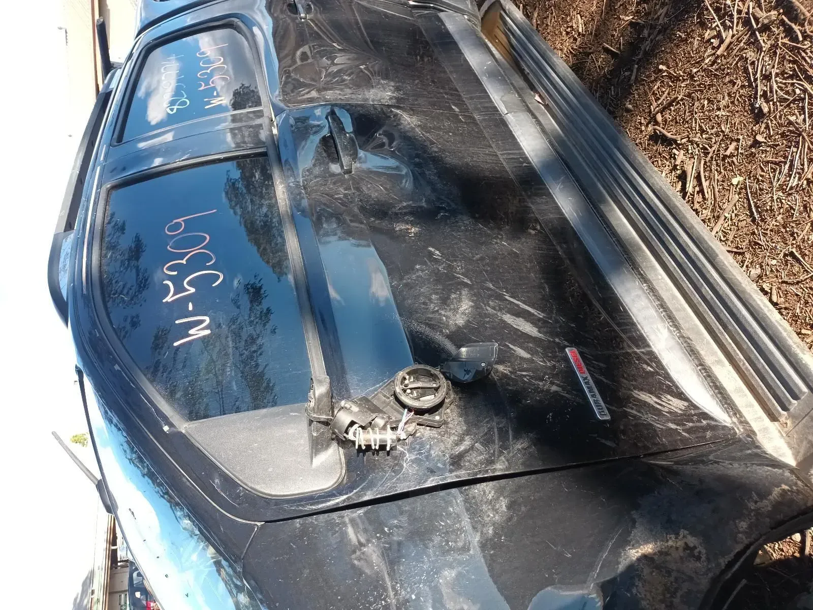 Black Car Roof With Windshield, Fuel Filler, and Marked With “W-5309” — South West 4WD Wreckers In Brisbane, QLD