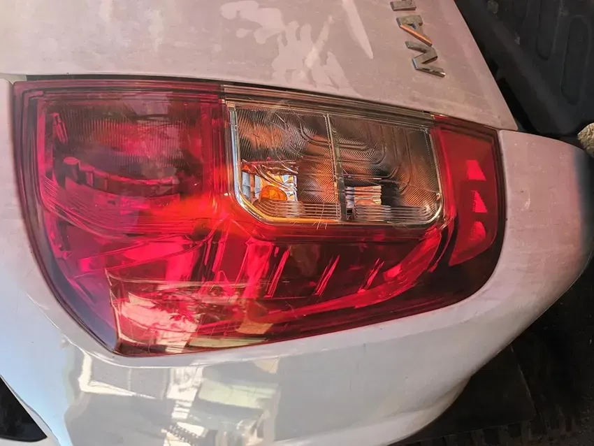 A Close Up of a Red Tail Light on a White Car — South West 4WD Wreckers In Brisbane, QLD
