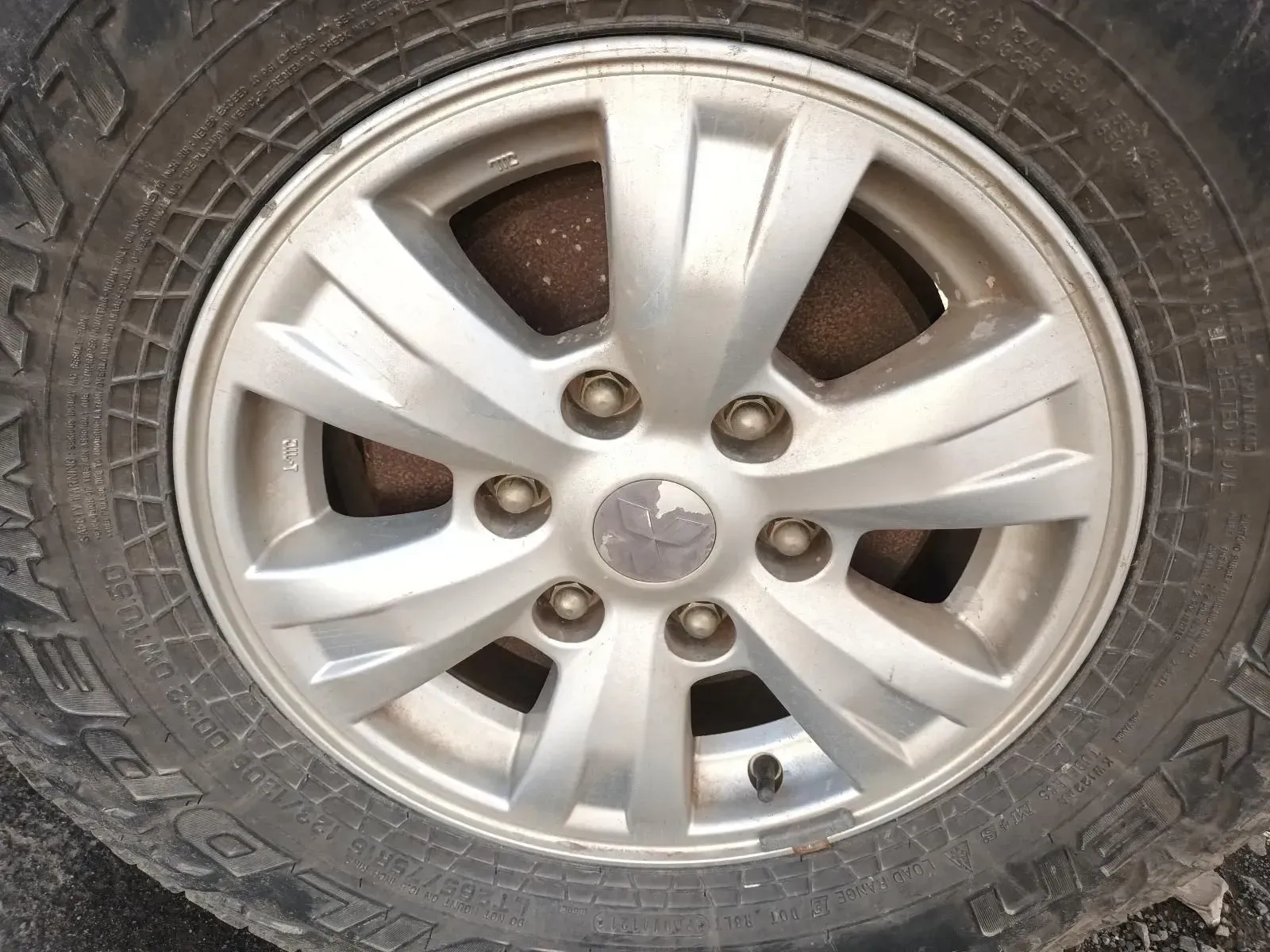 Close-up of a Car Tyre and Silver Alloy Wheel, With Visible Tread and Lug Nuts — South West 4WD Wreckers In Brisbane, QLD