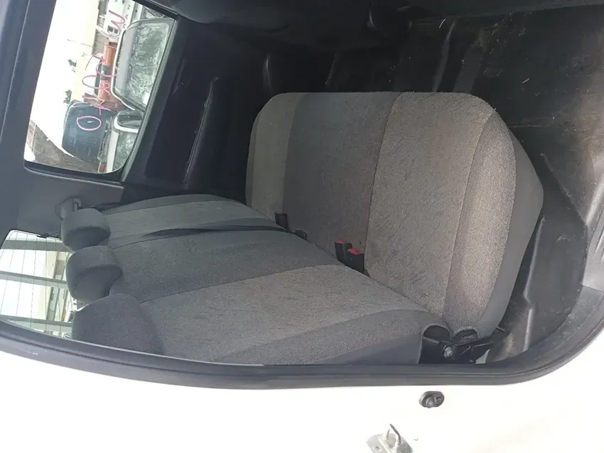 The Back Seat of a White Van With Grey Seat Covers — South West 4WD Wreckers In Brisbane, QLD