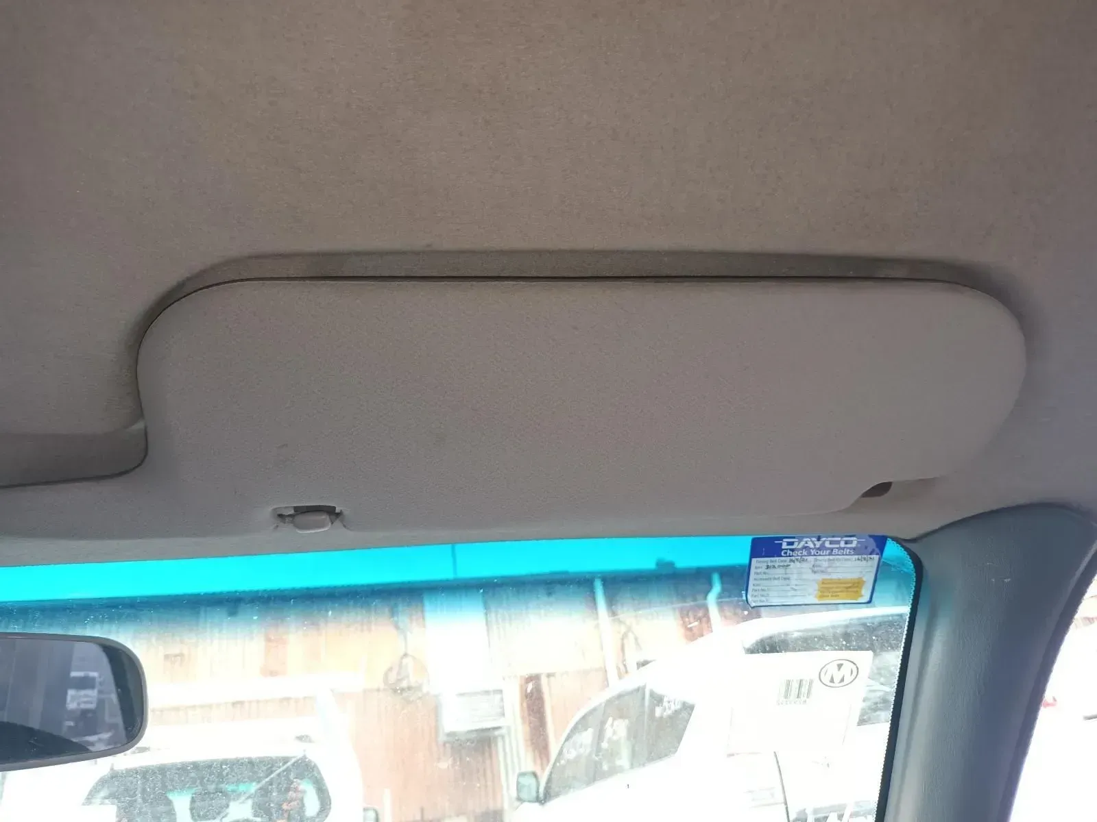 Tan Sun Visor Inside a Car, Positioned Above the Windshield and Rearview Mirror — South West 4WD Wreckers In Brisbane, QLD