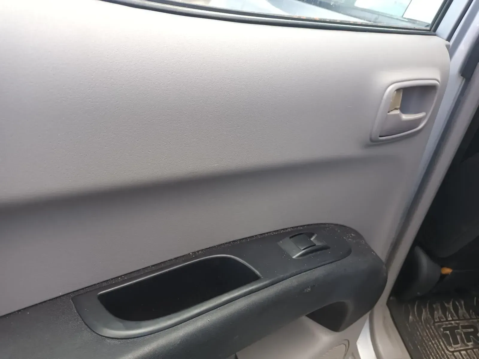 Gray Car Door Panel With Black Armrest, Handle, and Window Controls — South West 4WD Wreckers In Brisbane, QLD