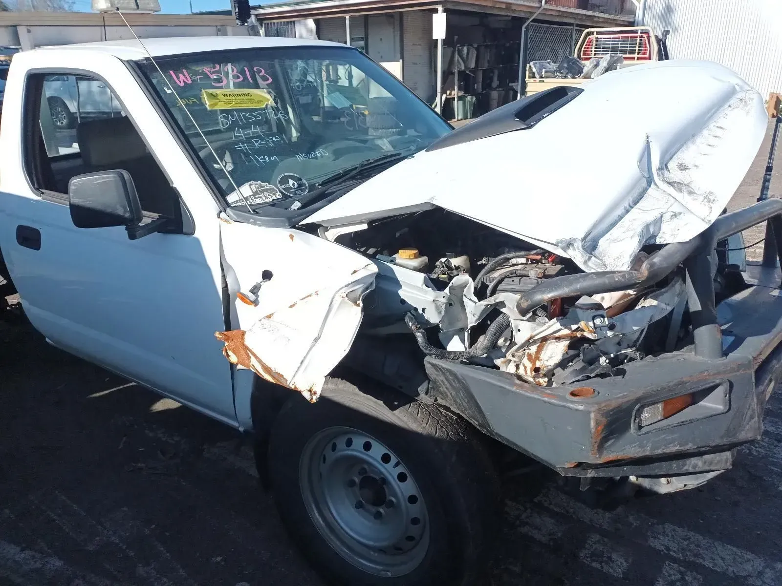 White Pickup Truck, Severely Damaged Front End, Visible Engine, Outdoor Setting — South West 4WD Wreckers In Brisbane, QLD