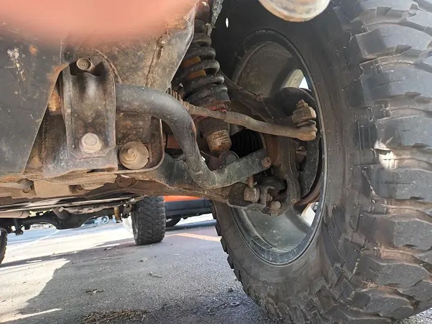 A Close Up of the Underside of a Vehicle with a Large Tire — South West 4WD Wreckers In Brisbane, QLD