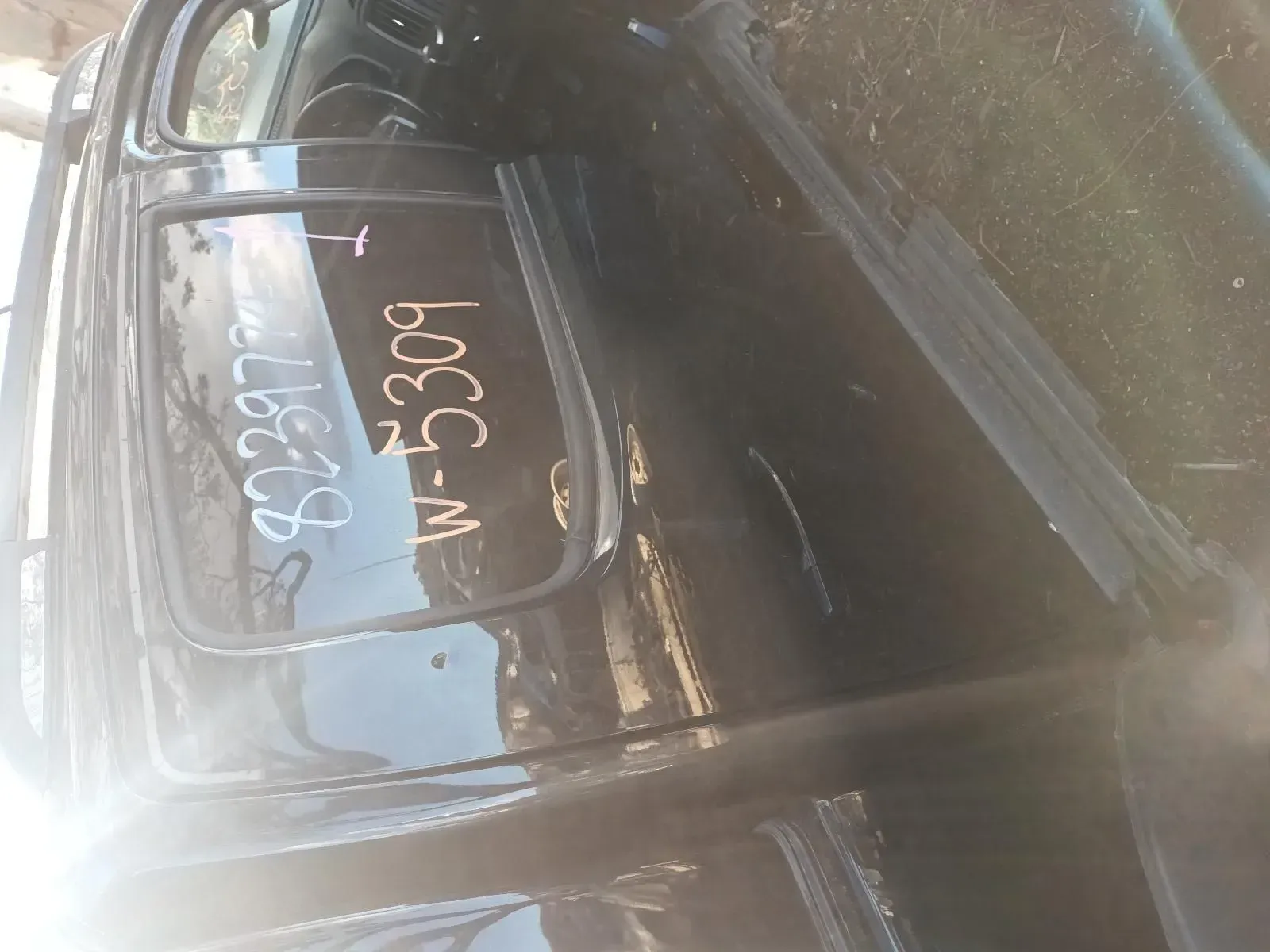 Black Car Door With Writing on the Window, Outdoors — South West 4WD Wreckers In Brisbane, QLD