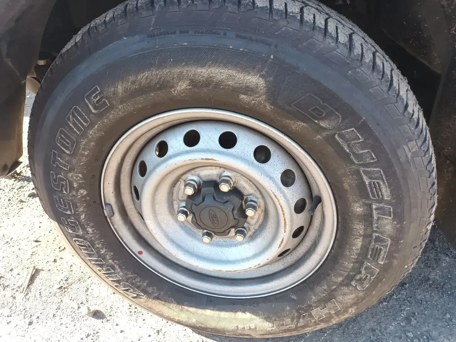 A Close-up of a Bridgestone Tyre on a Steel Rim — South West 4WD Wreckers In Brisbane, QLD