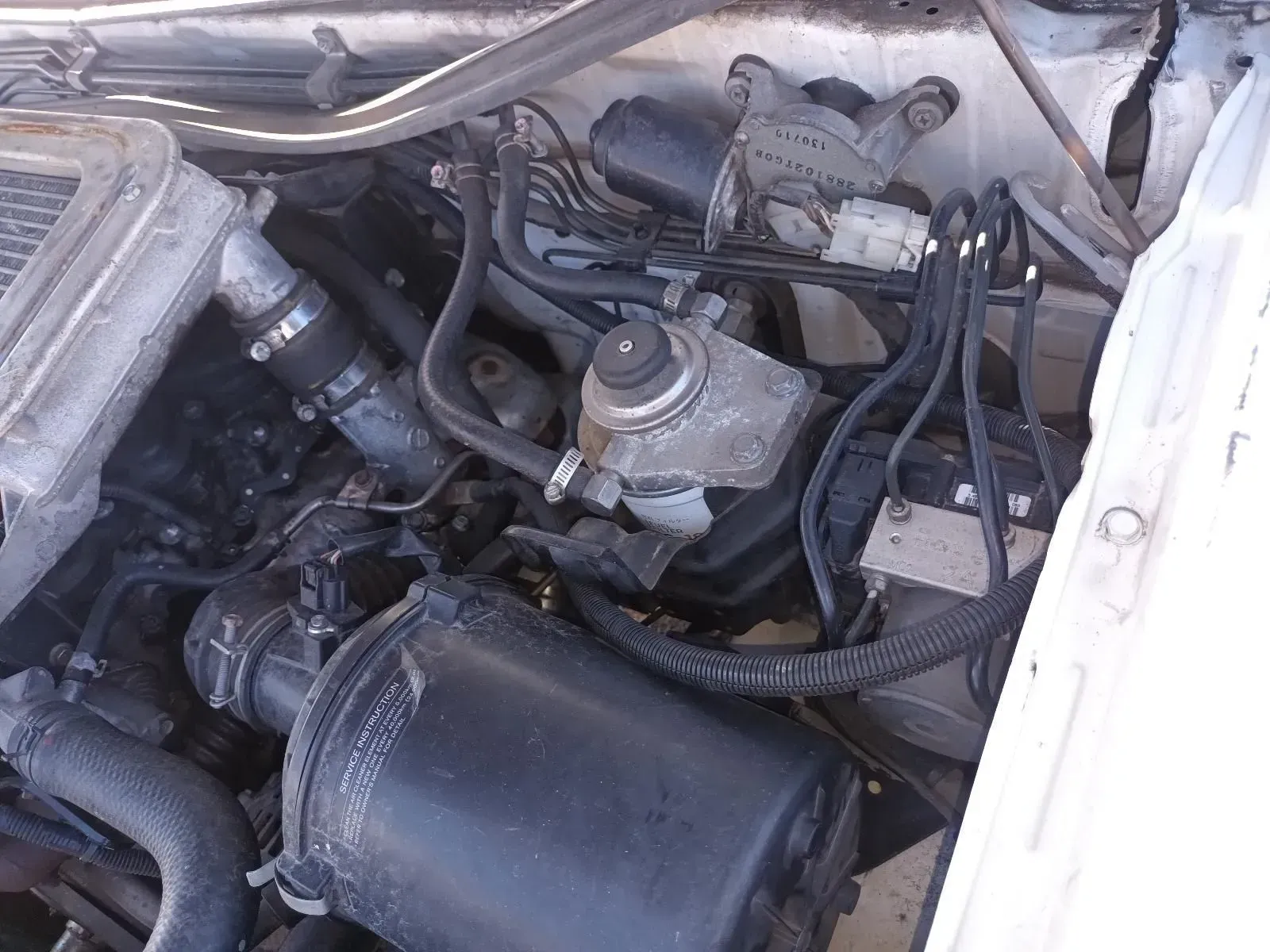 White Car Engine Compartment, Showing Various Components and Hoses — South West 4WD Wreckers In Brisbane, QLD