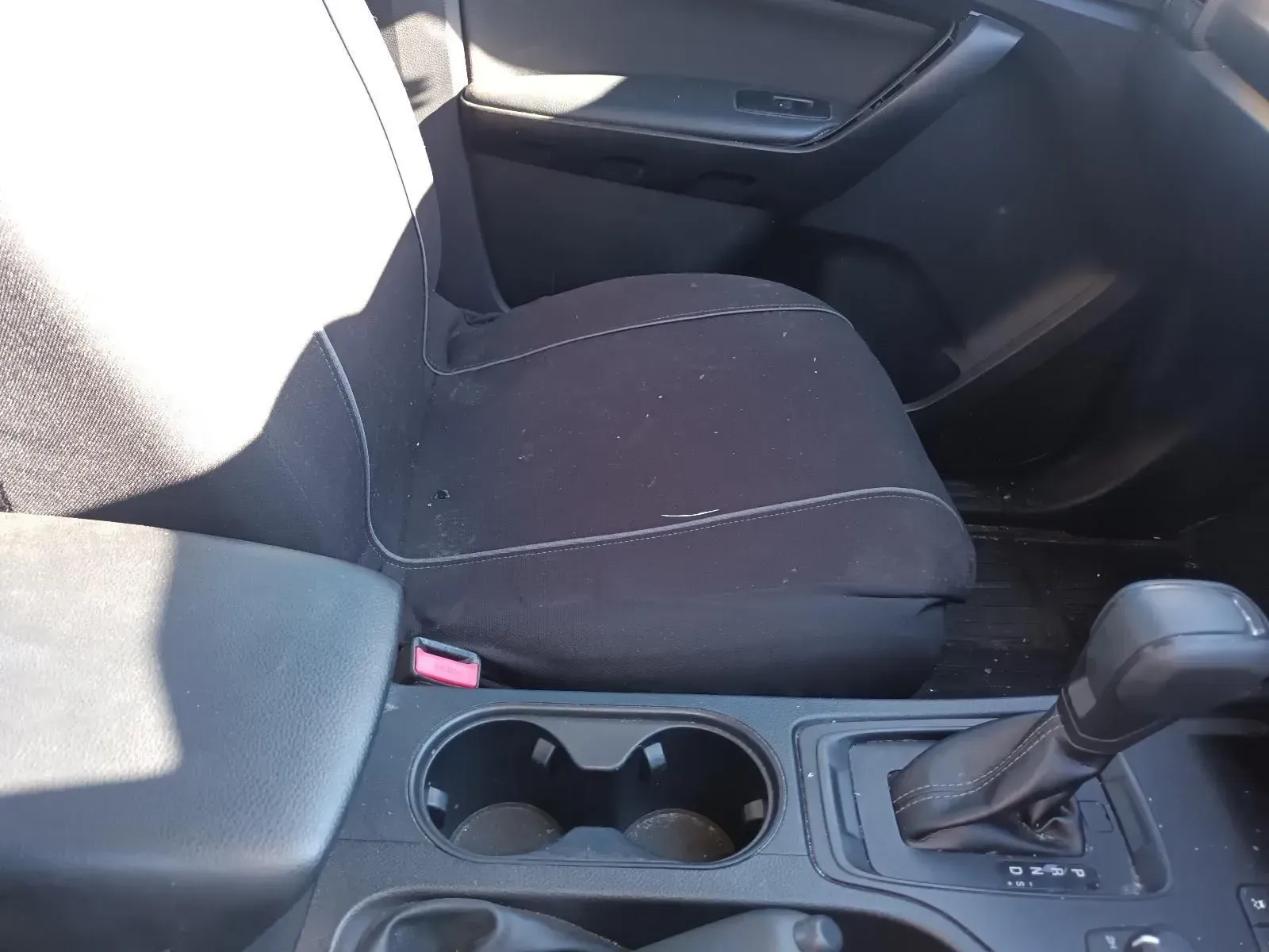 Interior of a Car, Showing the Driver's Seat, Cup Holders, and Gear Shift — South West 4WD Wreckers In Brisbane, QLD