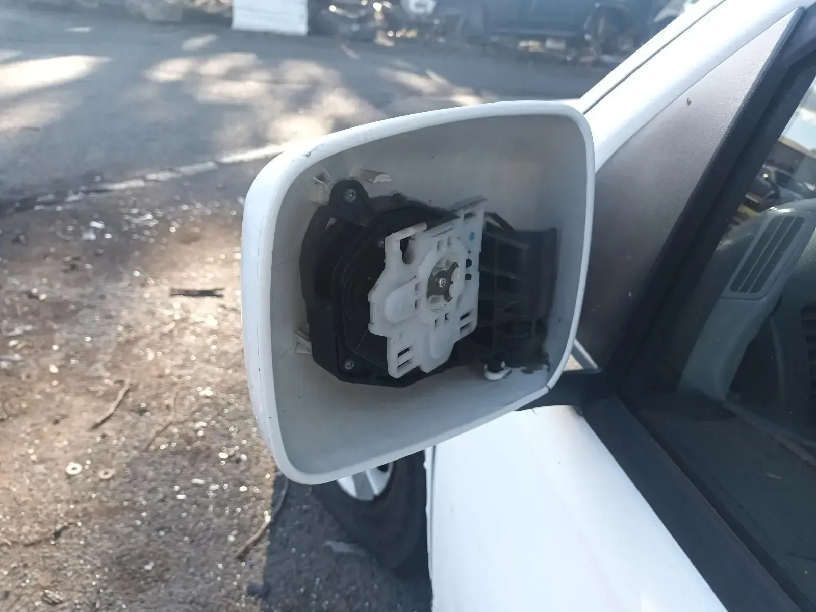 White Car Side Mirror Housing, Broken and Empty — South West 4WD Wreckers In Brisbane, QLD