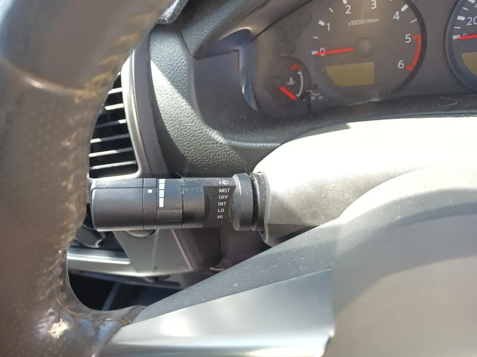 Dashboard and Steering Wheel of a Car, With Wiper Control Stalk Visible — South West 4WD Wreckers In Brisbane, QLD