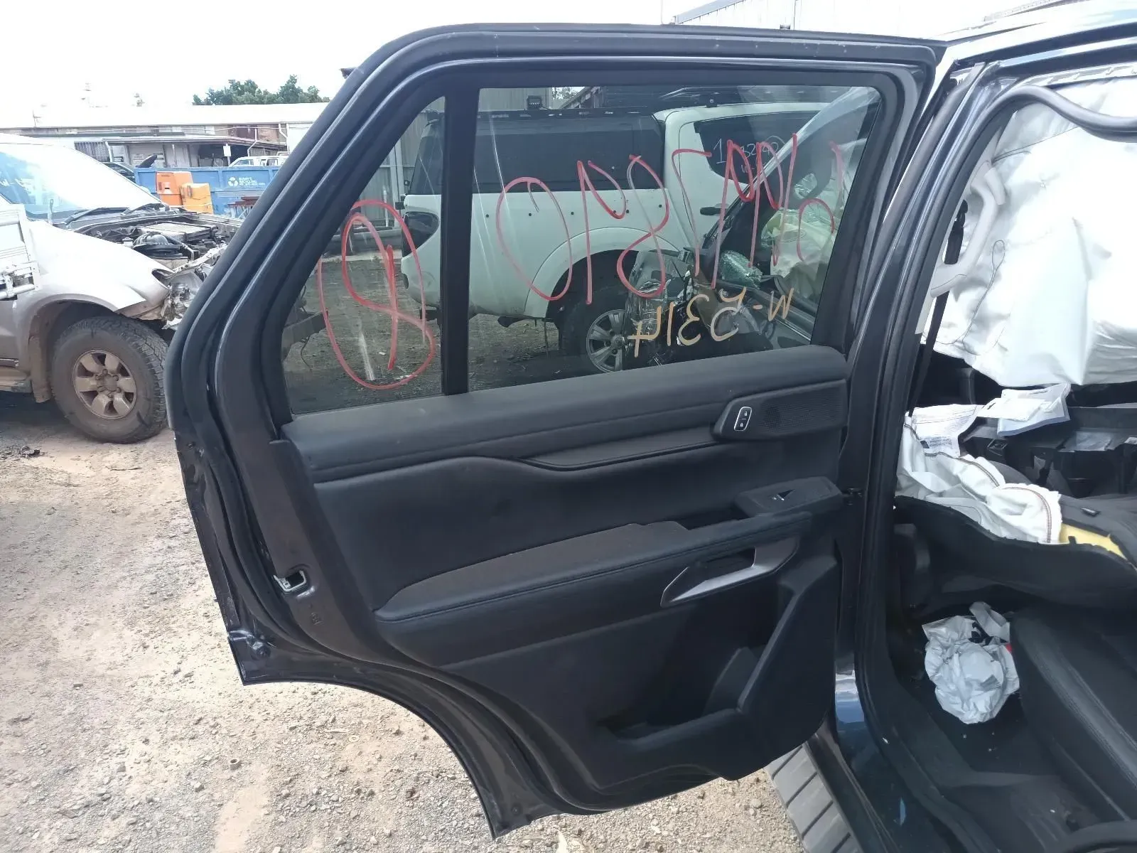 Black Car Door Interior, Damaged in a Salvage Yard — South West 4WD Wreckers In Brisbane, QLD