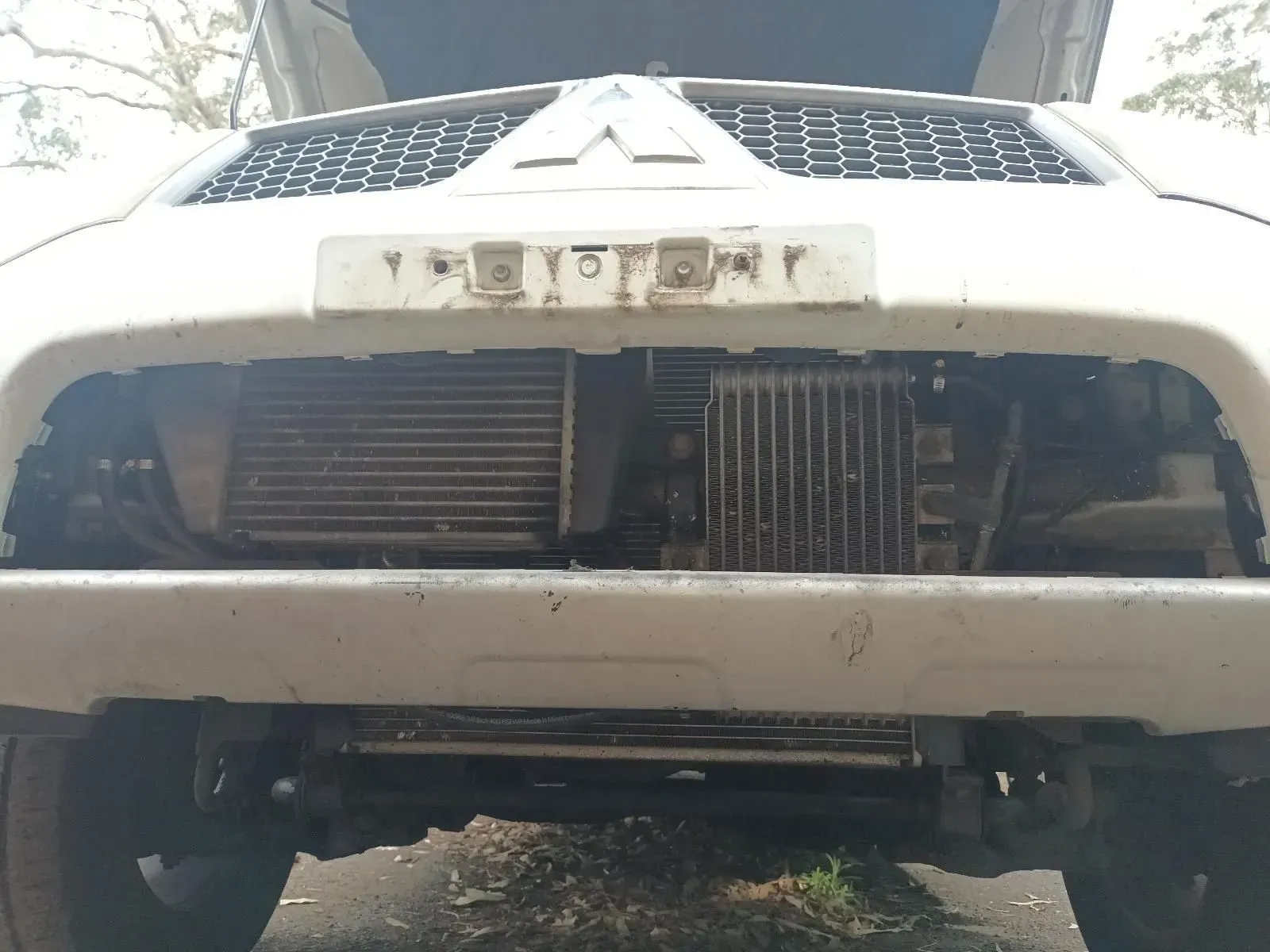 Front of a White Mitsubishi Suv With the Bumper Removed — South West 4WD Wreckers In Brisbane, QLD