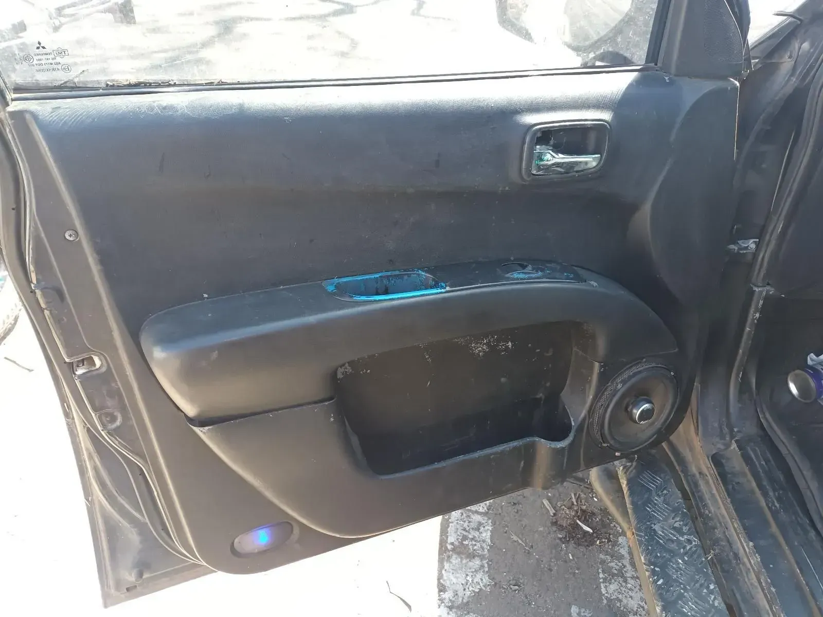 Car Door Interior With a Speaker, Blue Accents, and Broken Glass — South West 4WD Wreckers In Brisbane, QLD