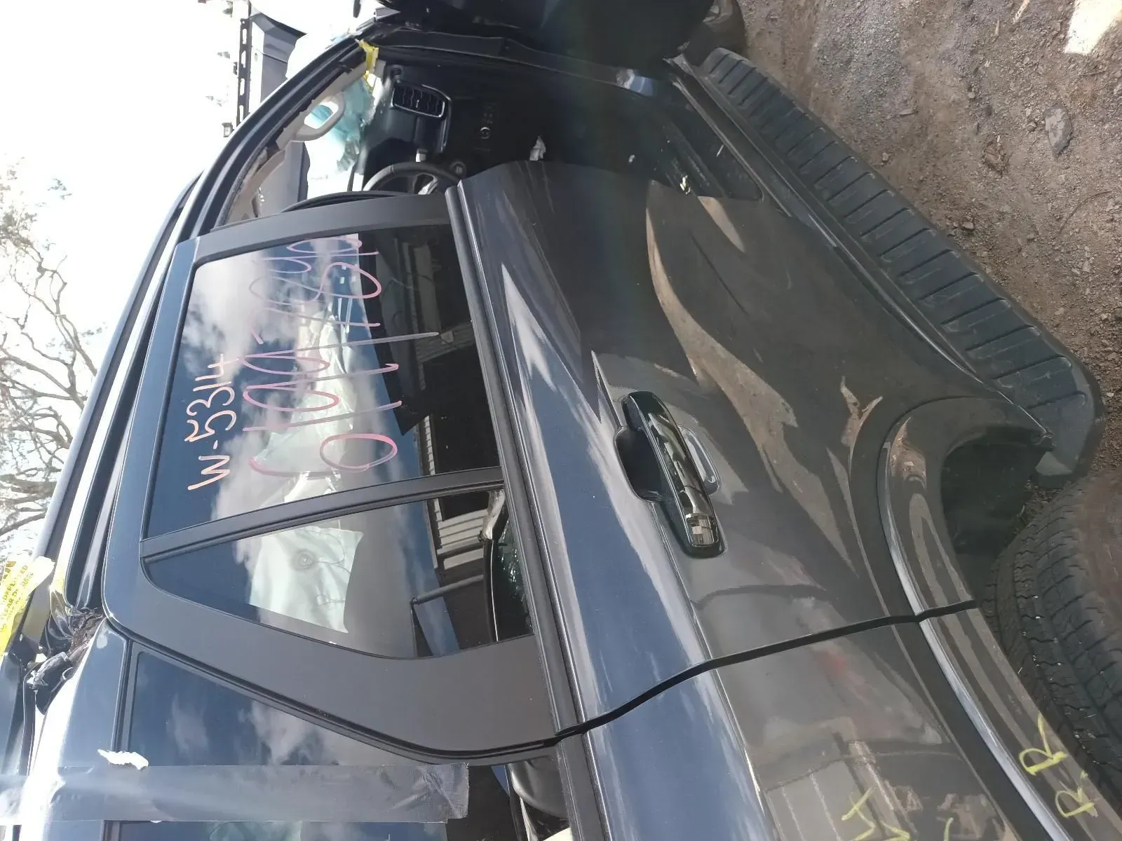Gray Car Door With Black Trim, and Partially Open Door in a Salvage Yard — South West 4WD Wreckers In Brisbane, QLD