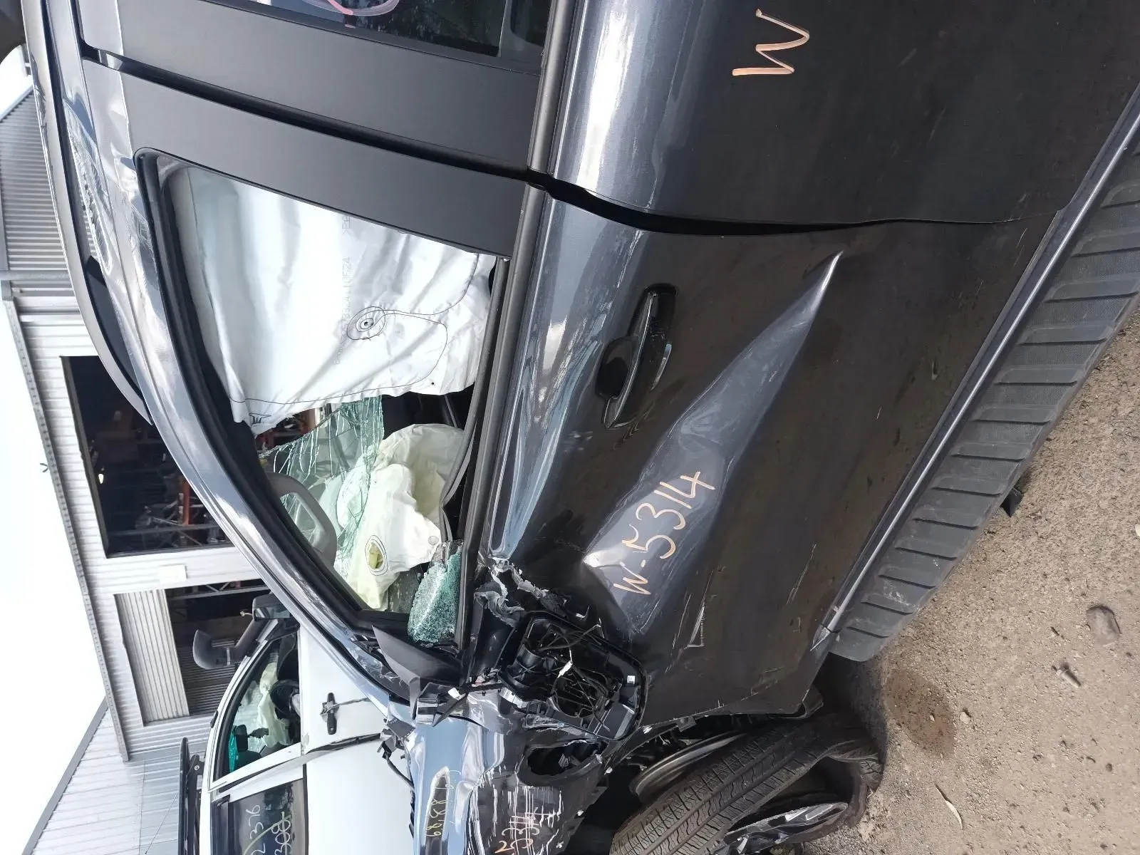 Damaged Black Car Side View — South West 4WD Wreckers In Brisbane, QLD