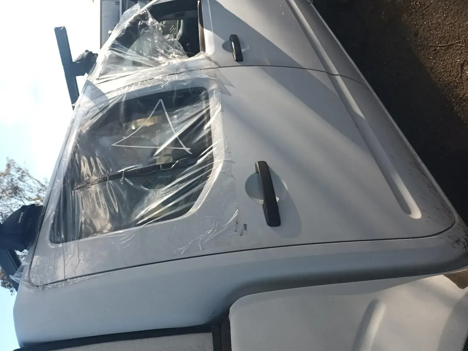 White Truck Cab With Plastic-covered Windows and Door — South West 4WD Wreckers In Brisbane, QLD