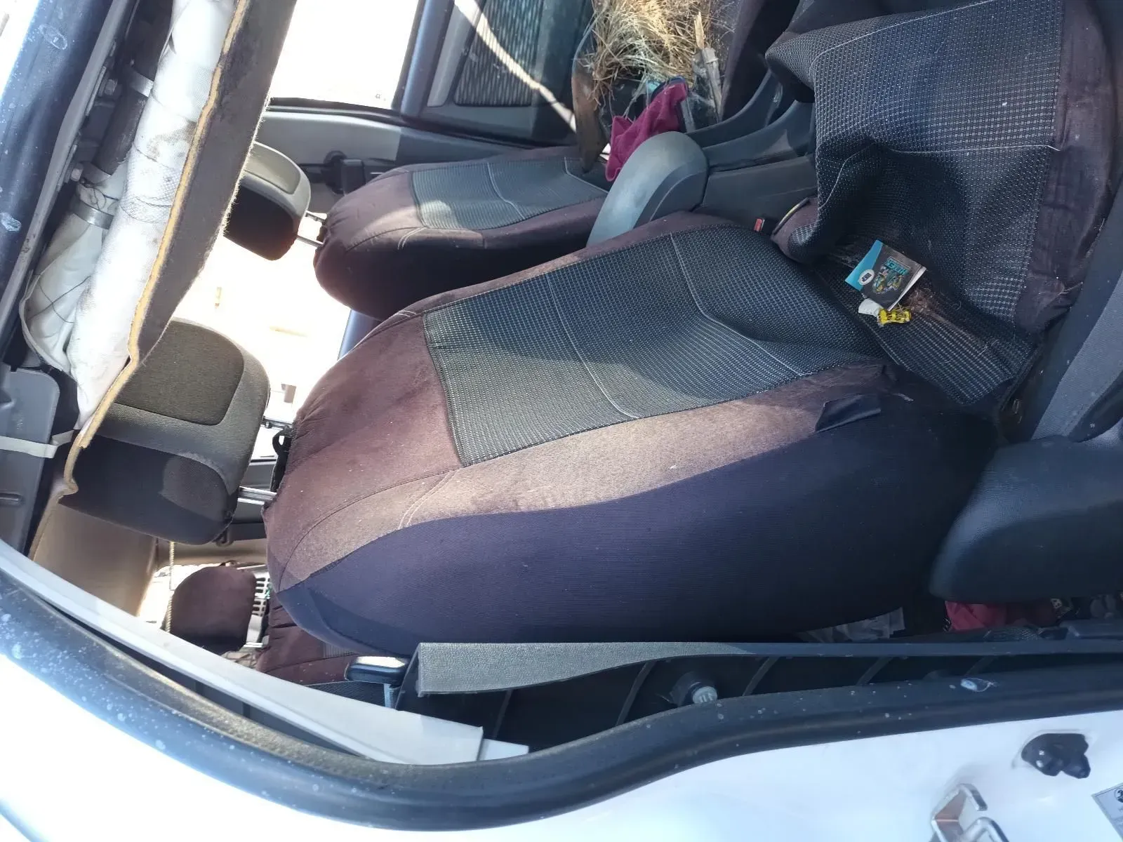 Car Interior With Worn, Brown and Black Seats — South West 4WD Wreckers In Brisbane, QLD