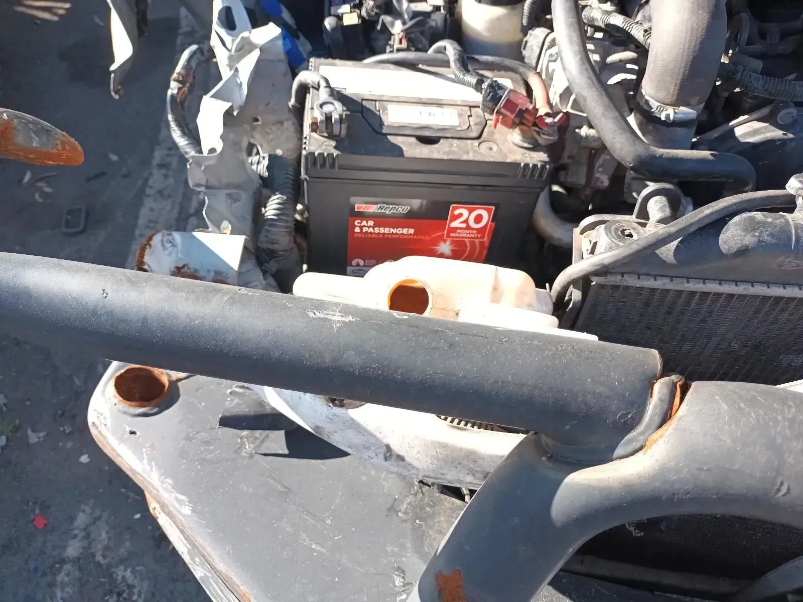 Car Engine Compartment With Battery, Coolant Reservoir — South West 4WD Wreckers In Brisbane, QLD