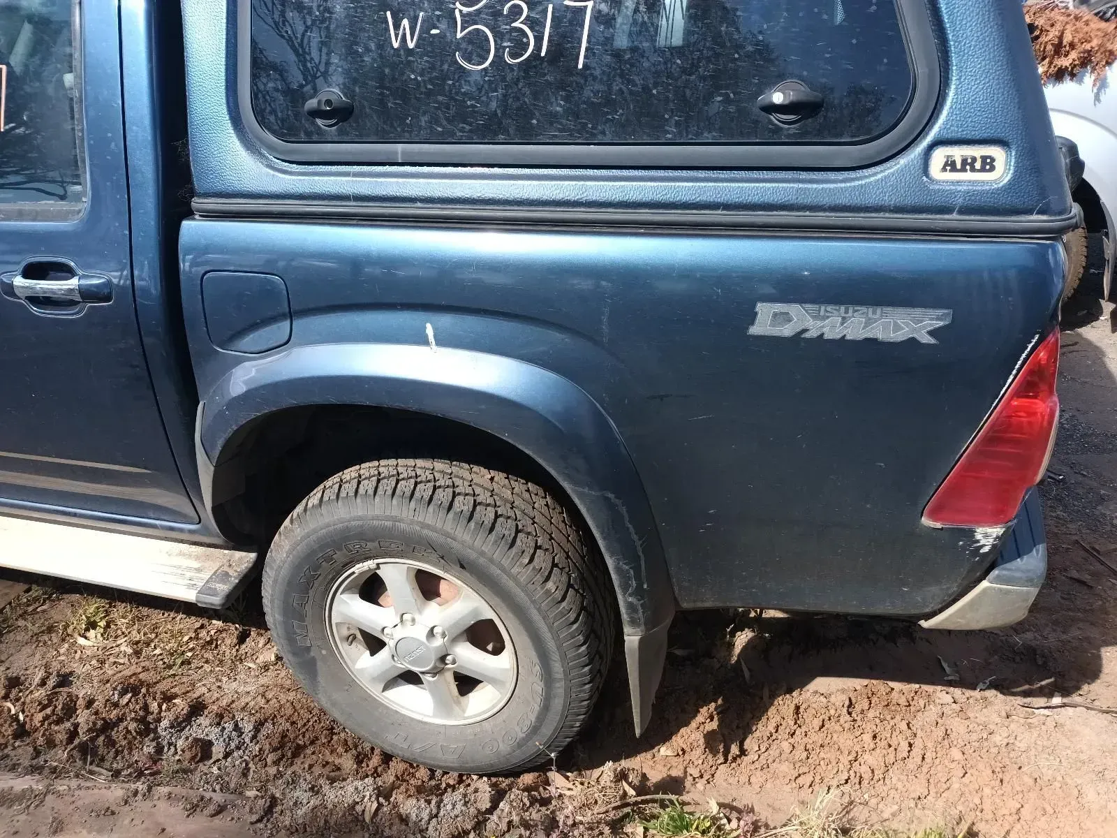 Blue Pickup Truck With Camper Shell, Parked Outdoors — South West 4WD Wreckers In Brisbane, QLD