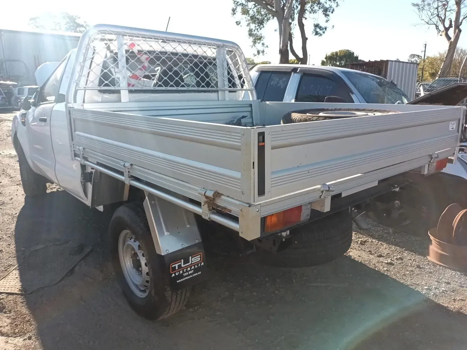 White Pickup Truck With a Flatbed in a Sunny Outdoor Setting — South West 4WD Wreckers In Brisbane, QLD