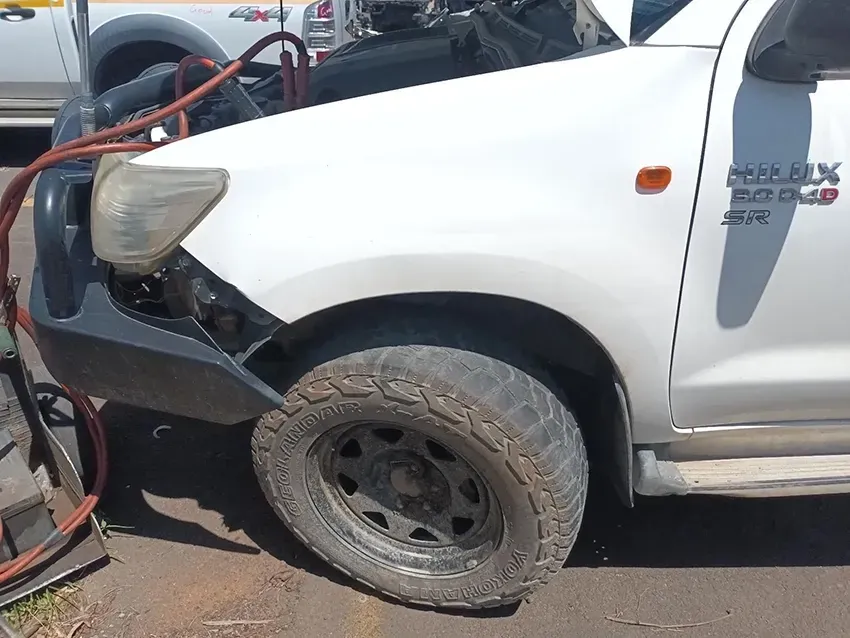 A White Hilux Pickup Truck With a Broken Bumper — South West 4WD Wreckers In Brisbane, QLD