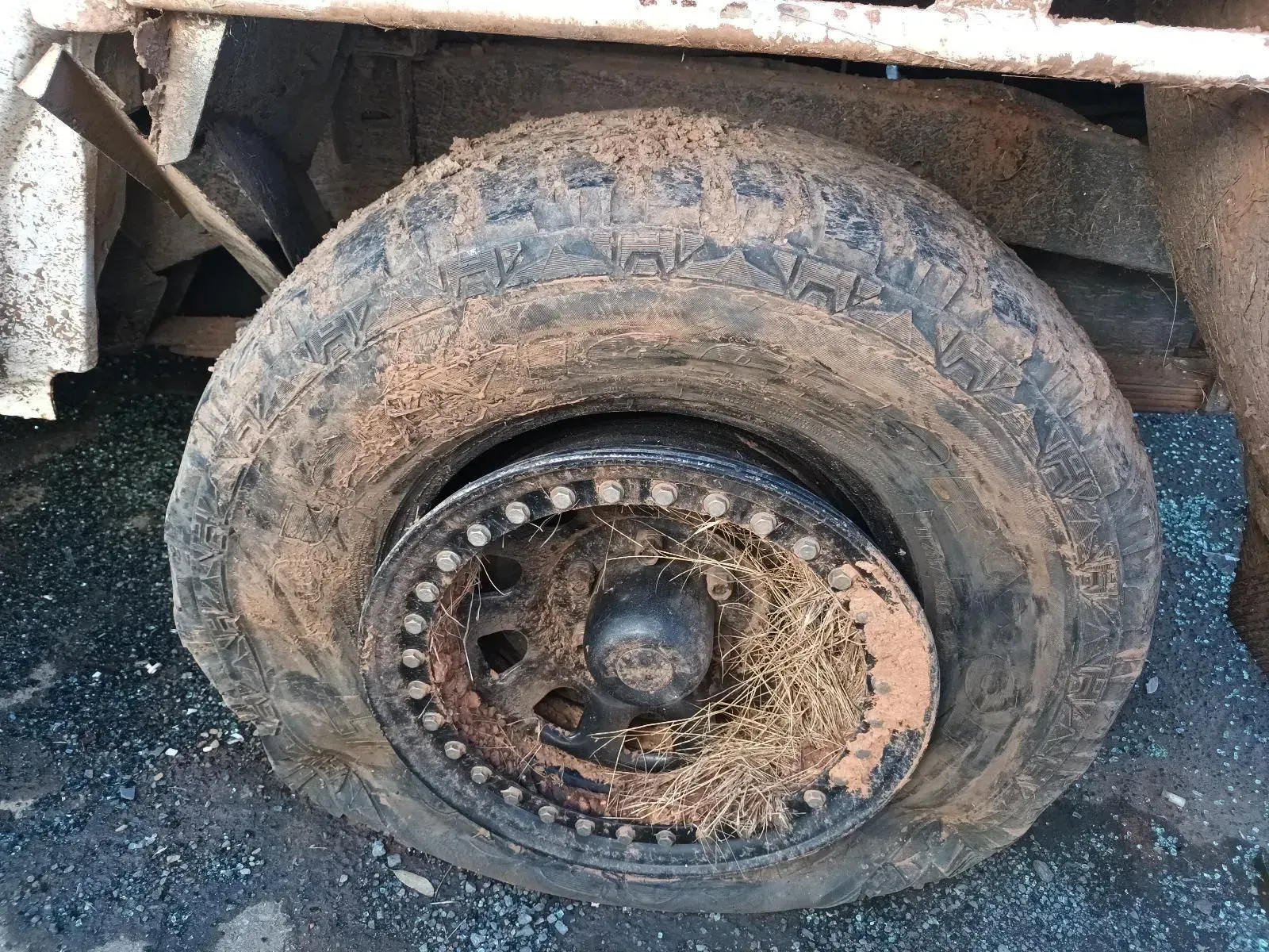 Flat, Mud-covered Tyre on a Rusty, Off-road Vehicle — South West 4WD Wreckers In Brisbane, QLD