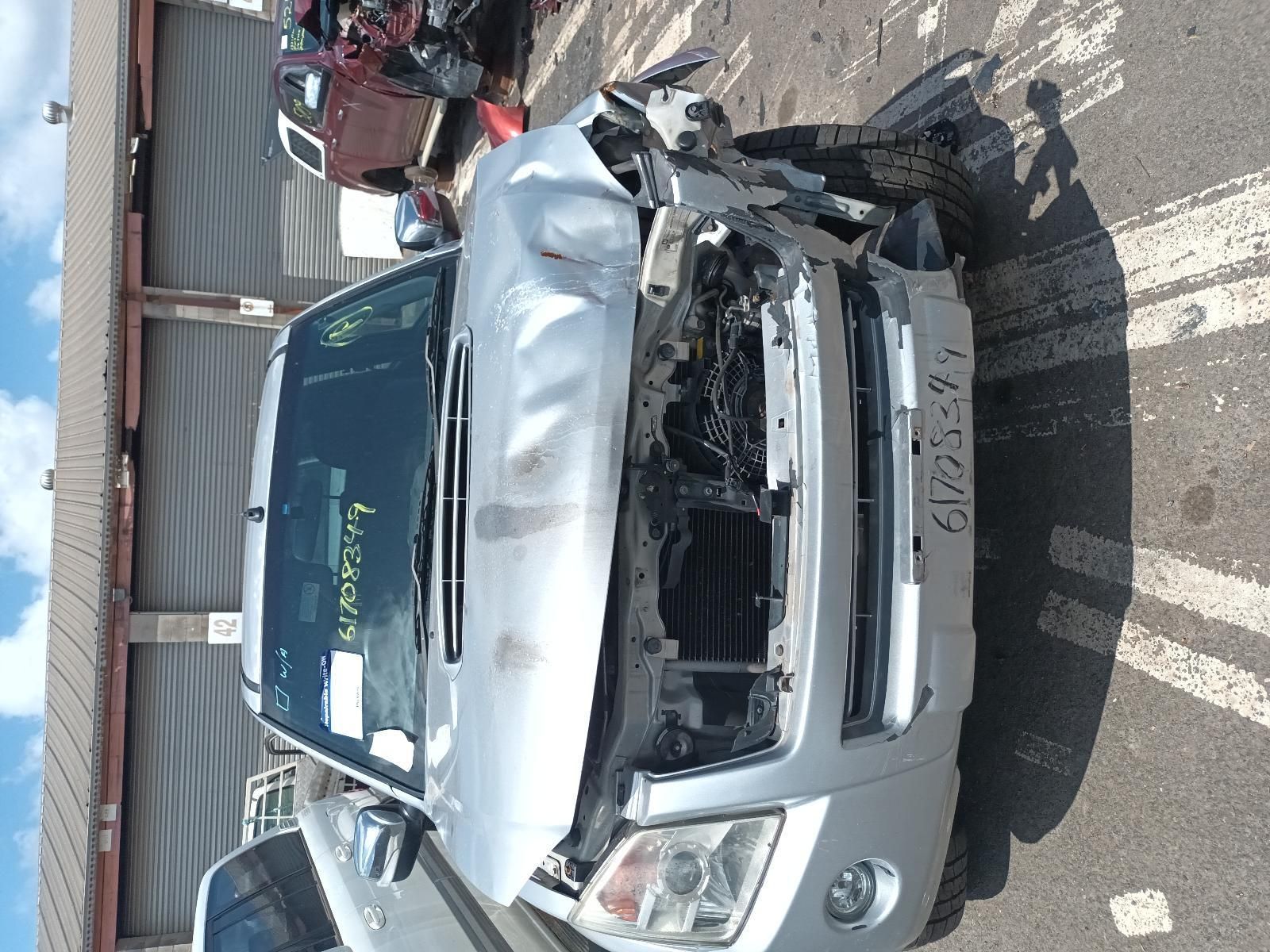 A Silver Car with a Damaged Front End is Parked — South West 4WD Wreckers in Harristown, QLD