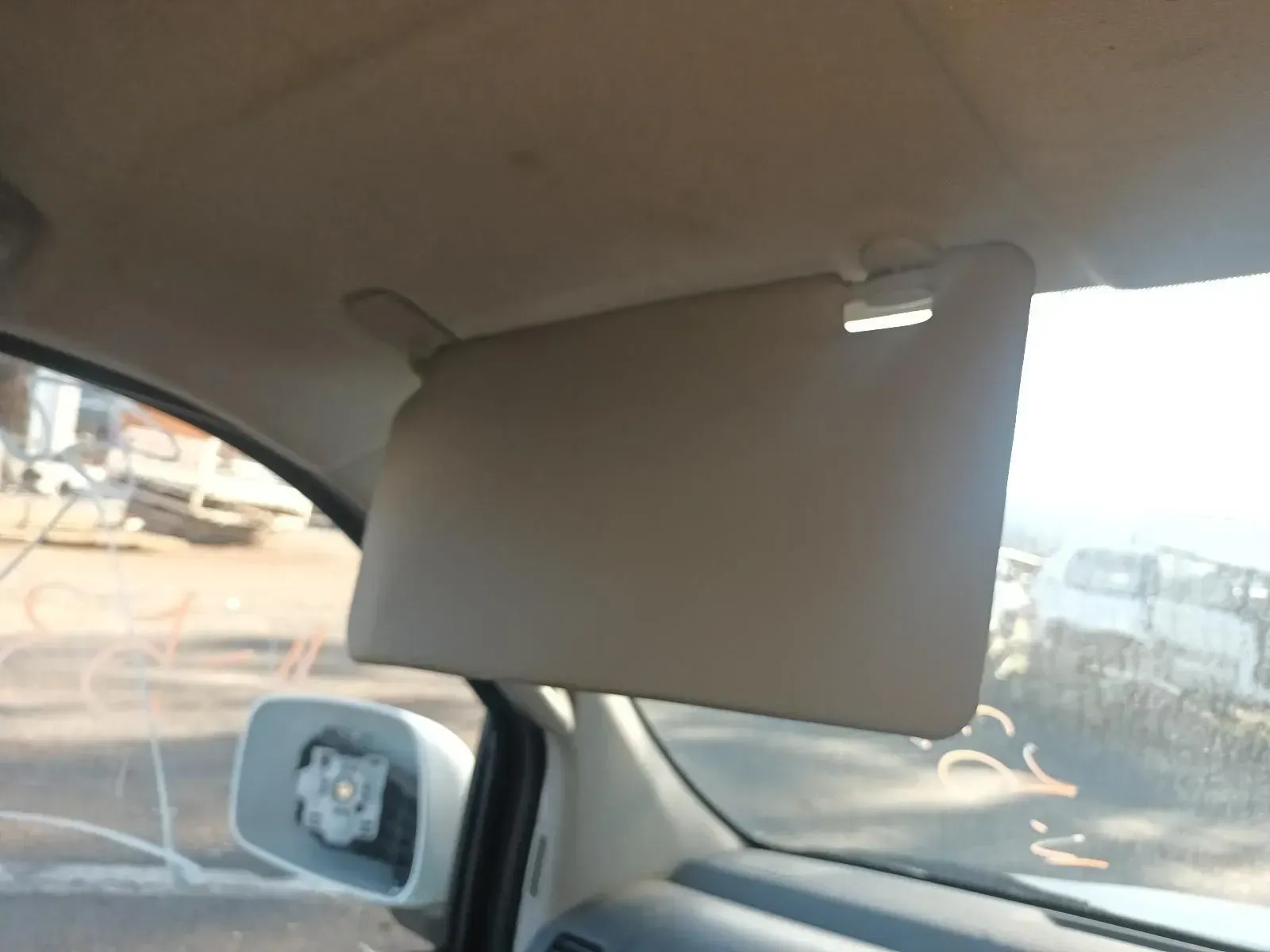 Beige Car Sun Visor, Partially Blocking the Windshield, Inside a Vehicle — South West 4WD Wreckers In Brisbane, QLD