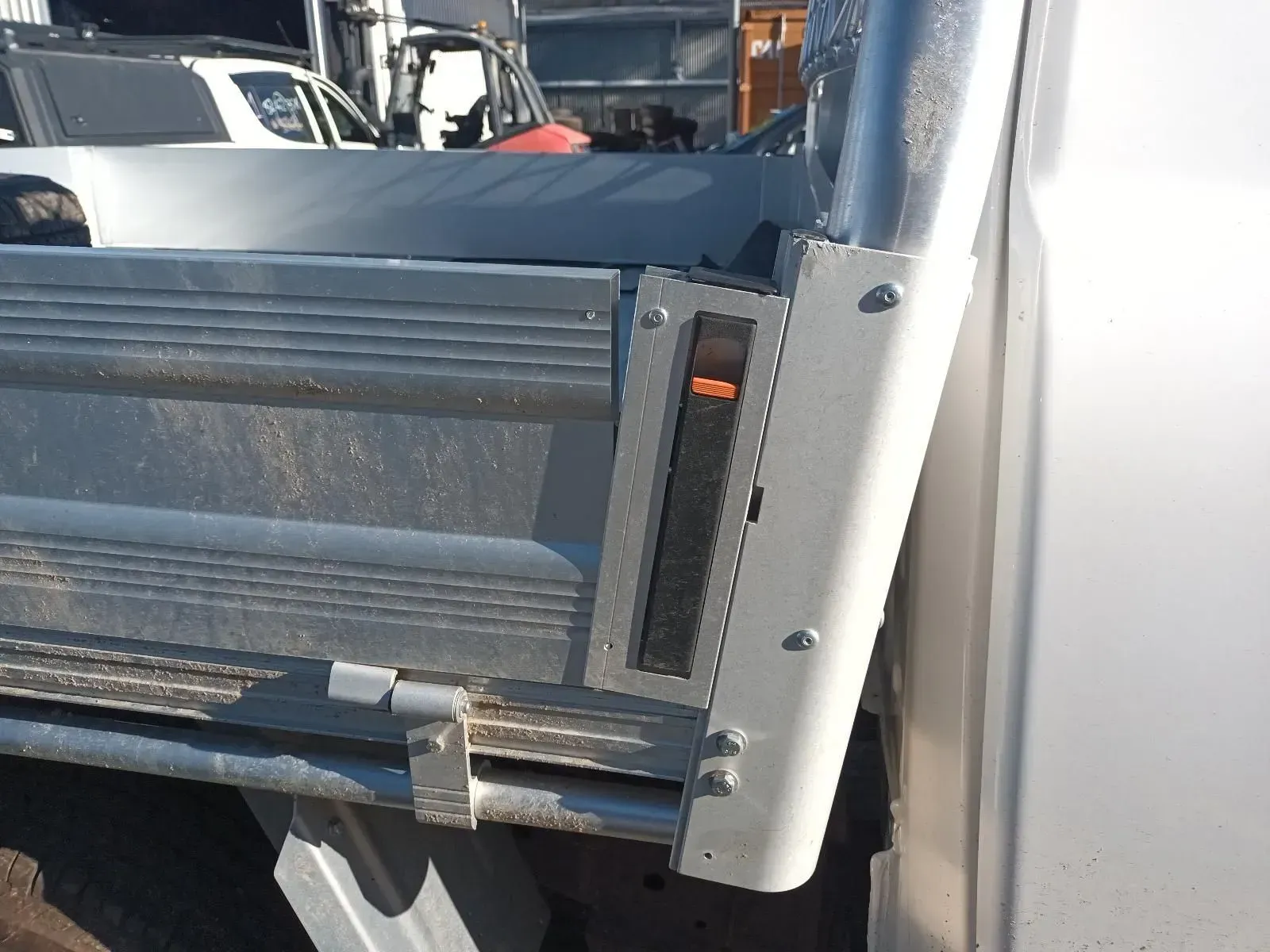 Silver Utility Truck Tray With a Black Light Fixture and Orange Detail — South West 4WD Wreckers In Brisbane, QLD