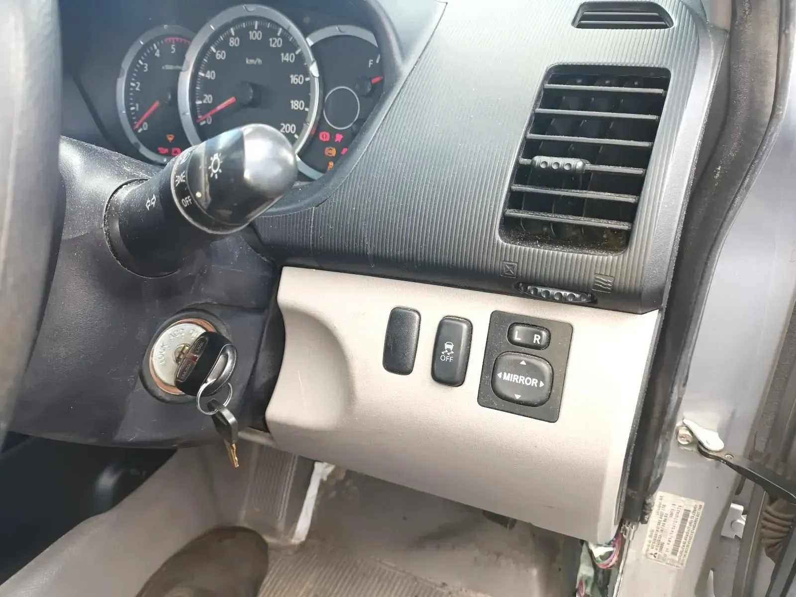 Dashboard of a Car With Gauges, Turn Signal, Ignition, and Side Mirror Controls — South West 4WD Wreckers In Brisbane, QLD