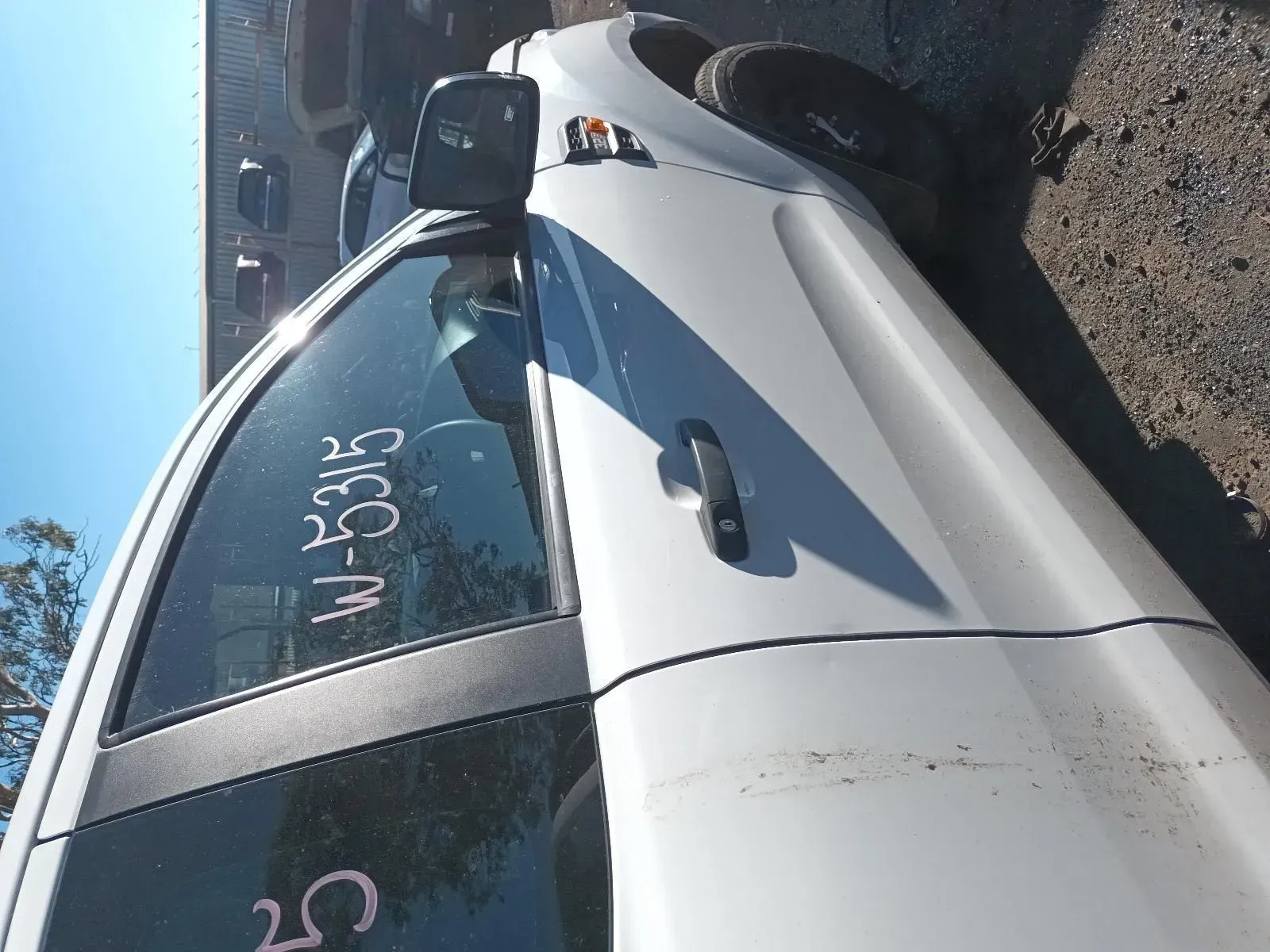 White Pickup Truck Door With Side Mirror, Parked Outdoors in a Sunny Environment — South West 4WD Wreckers In Brisbane, QLD