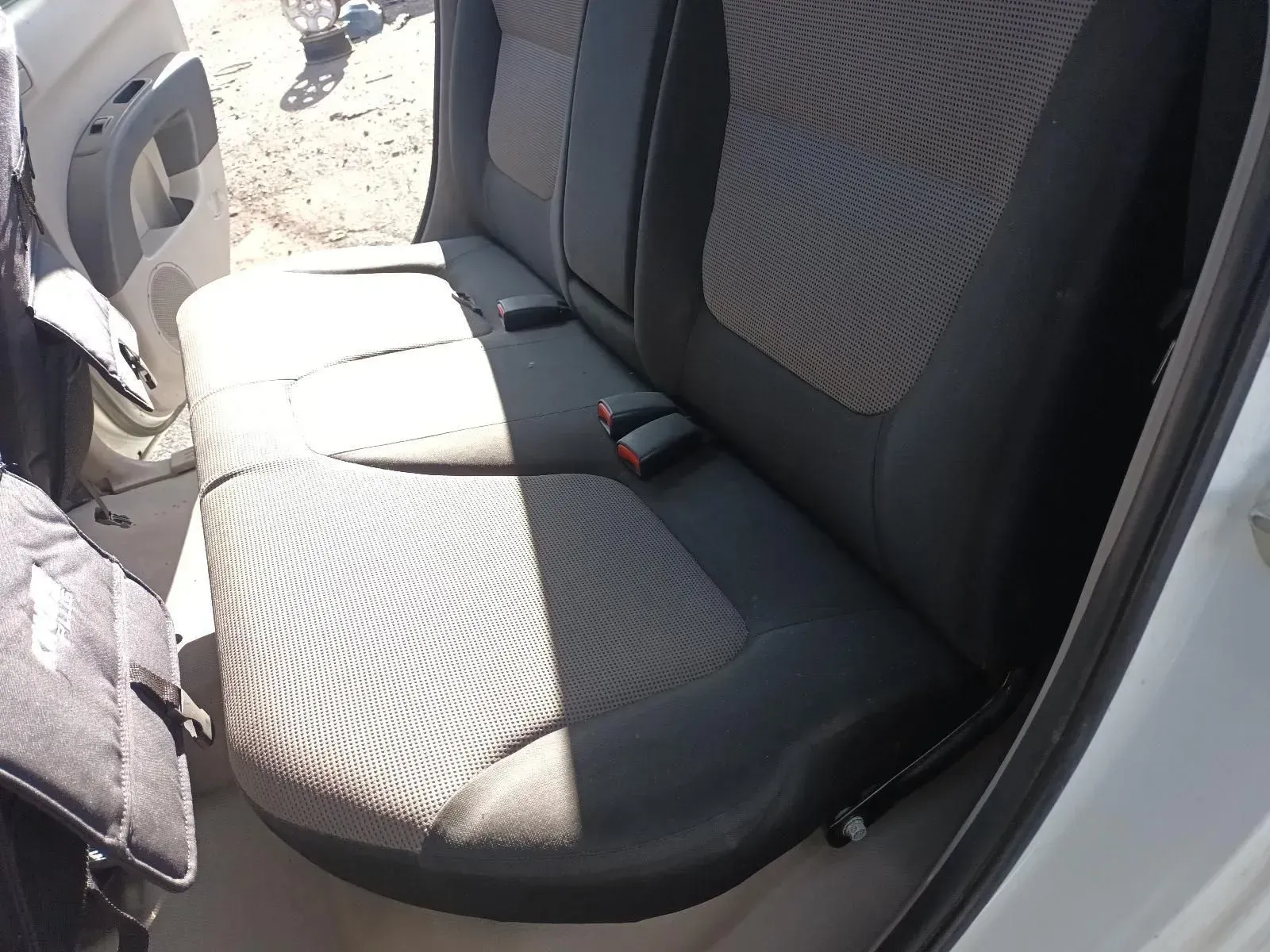 Car's Gray Patterned Rear Seats. Two Seatbelts Visible — South West 4WD Wreckers In Brisbane, QLD