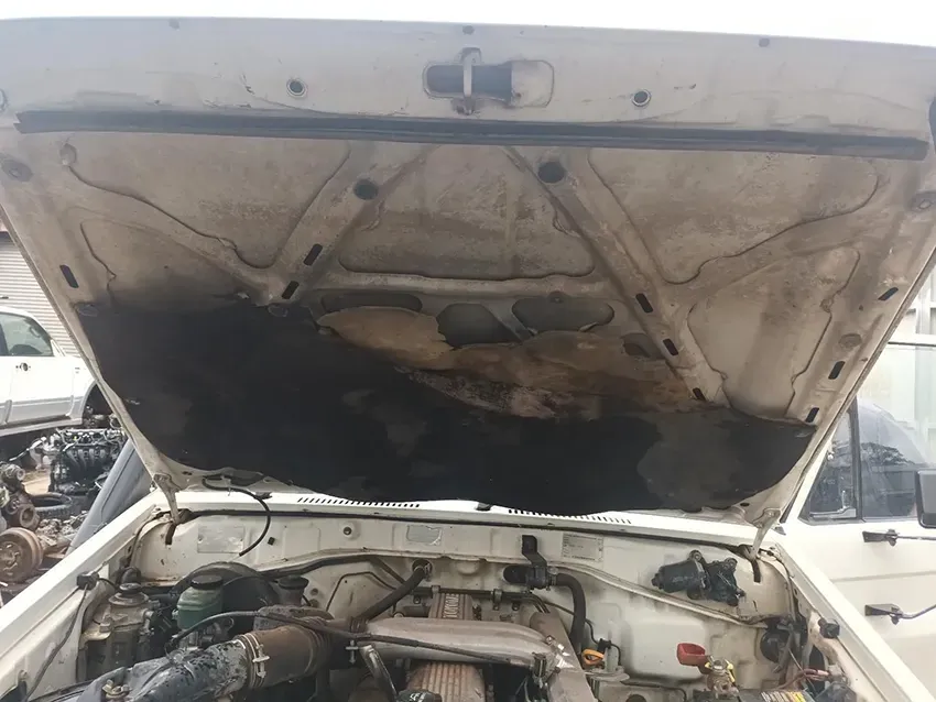 A White Car With the Hood Up and the Engine Exposed — South West 4WD Wreckers In Brisbane, QLD