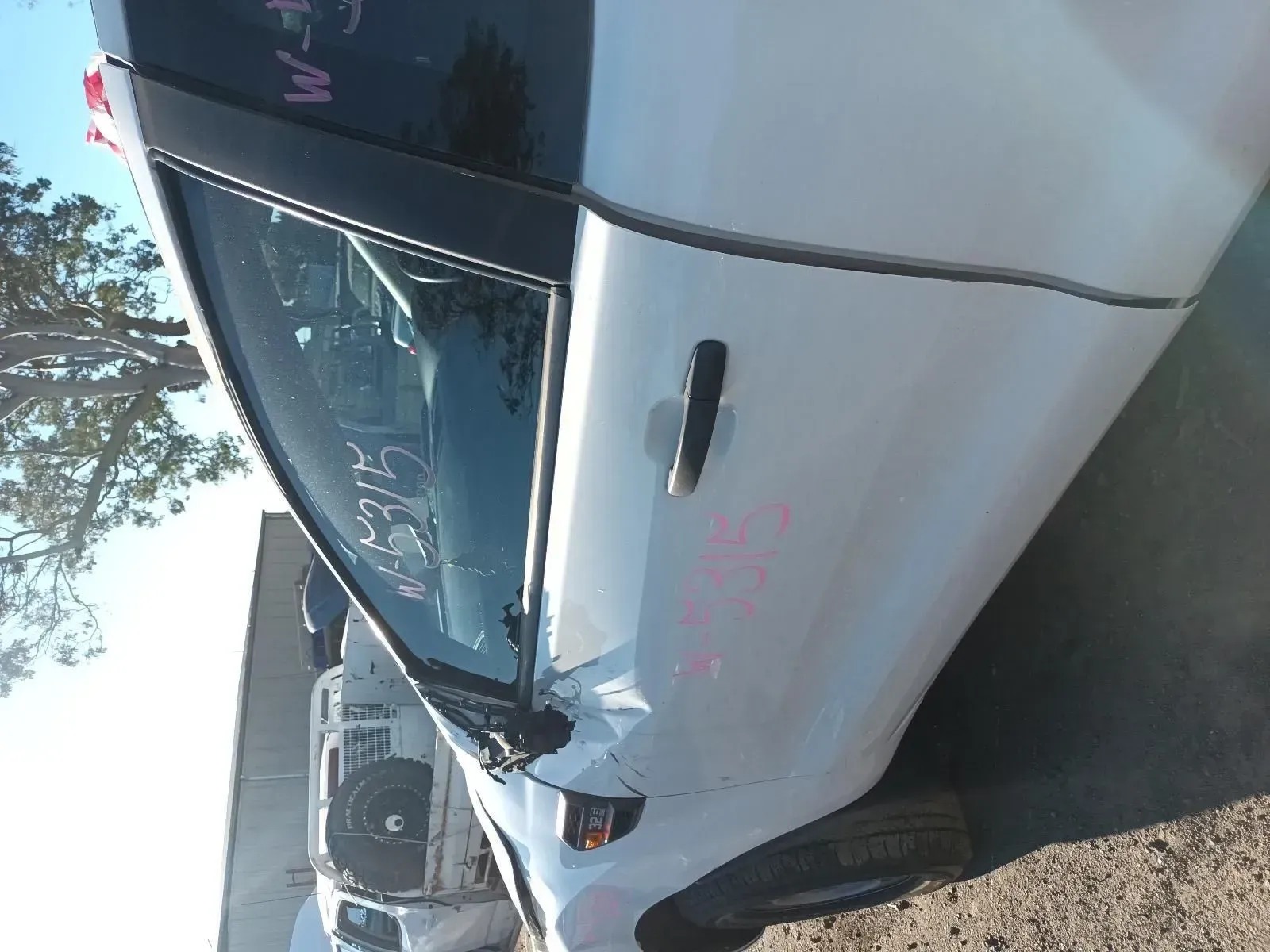 White Car Door With Black Trim and a Door Handle in a Junkyard — South West 4WD Wreckers In Brisbane, QLD