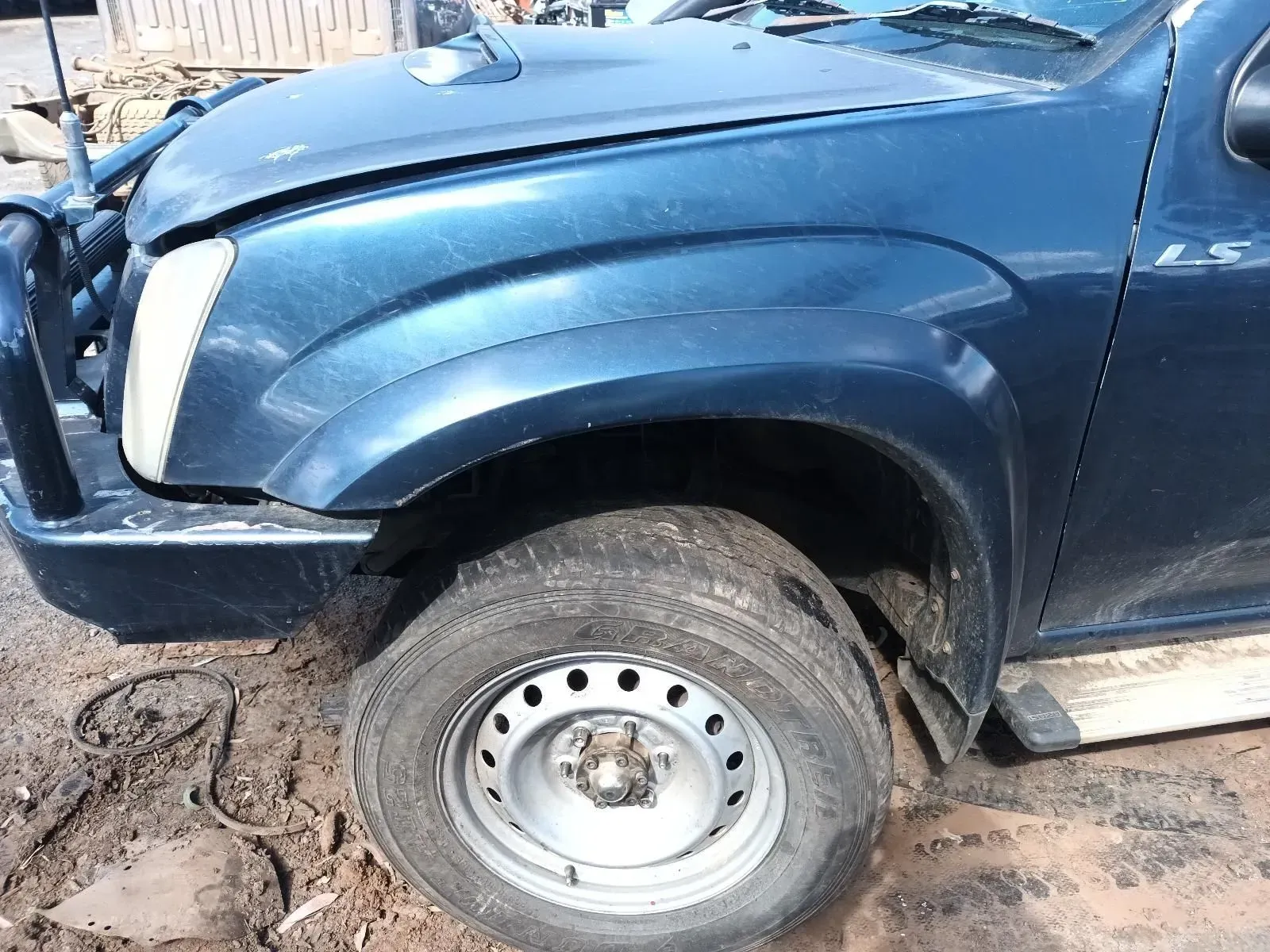 Dark Blue Pickup Truck, Damaged Front, Rusty Wheel, Outdoors — South West 4WD Wreckers In Brisbane, QLD