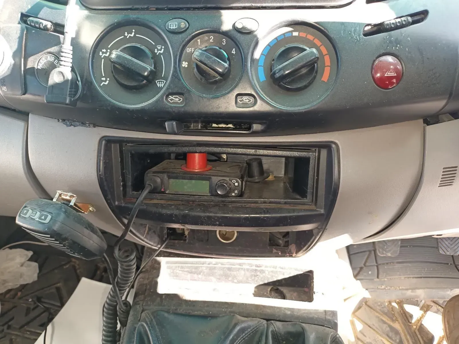 Dashboard of a Vehicle With a Cb Radio Installed in the Center Console — South West 4WD Wreckers In Brisbane, QLD